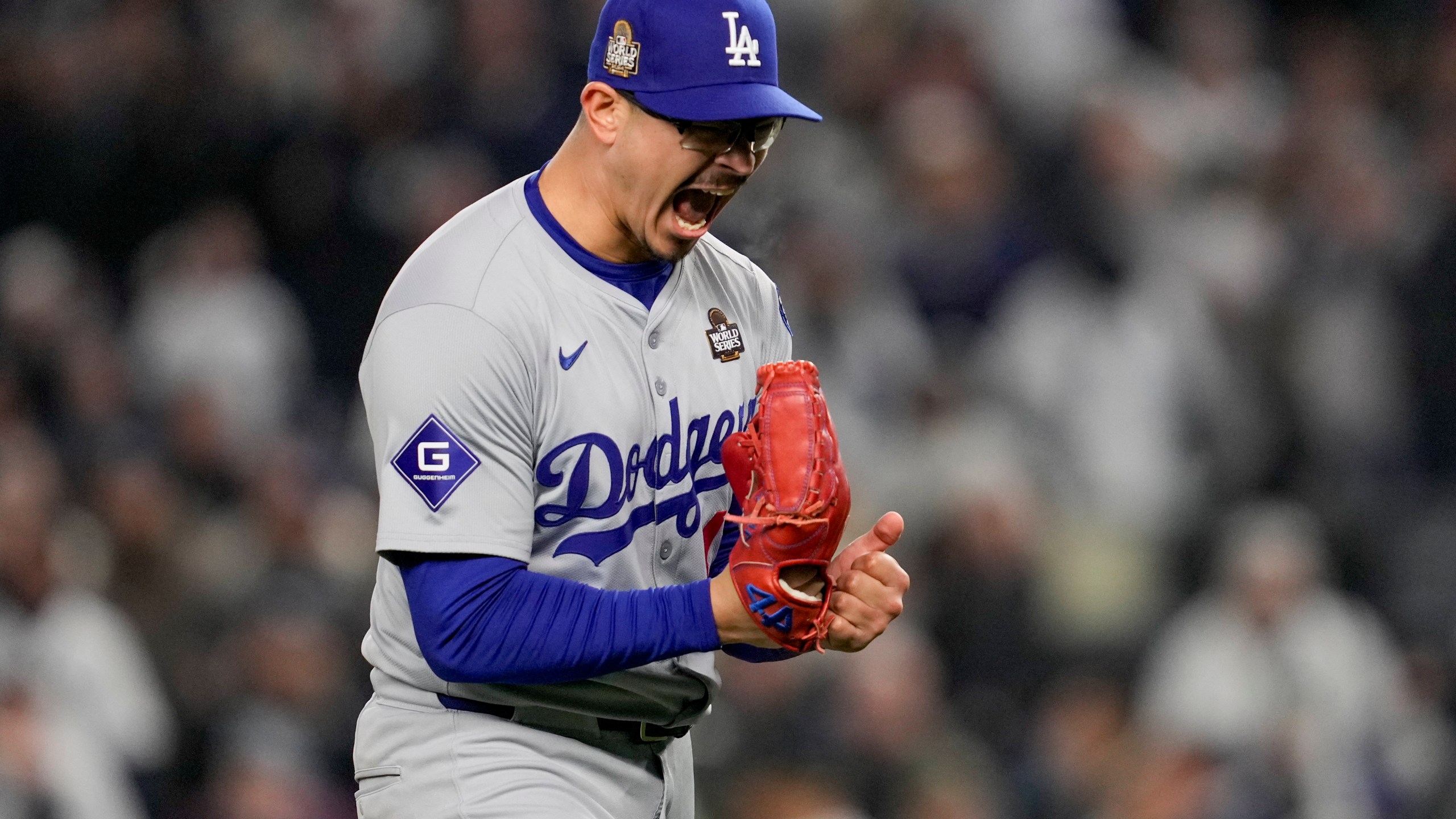 Los Angeles Dodgers pitcher Anthony Banda celebrates the end of the seventh inning in Game 3 of the baseball World Series against the New York Yankees, Monday, Oct. 28, 2024, in New York. (AP Photo/Ashley Landis)