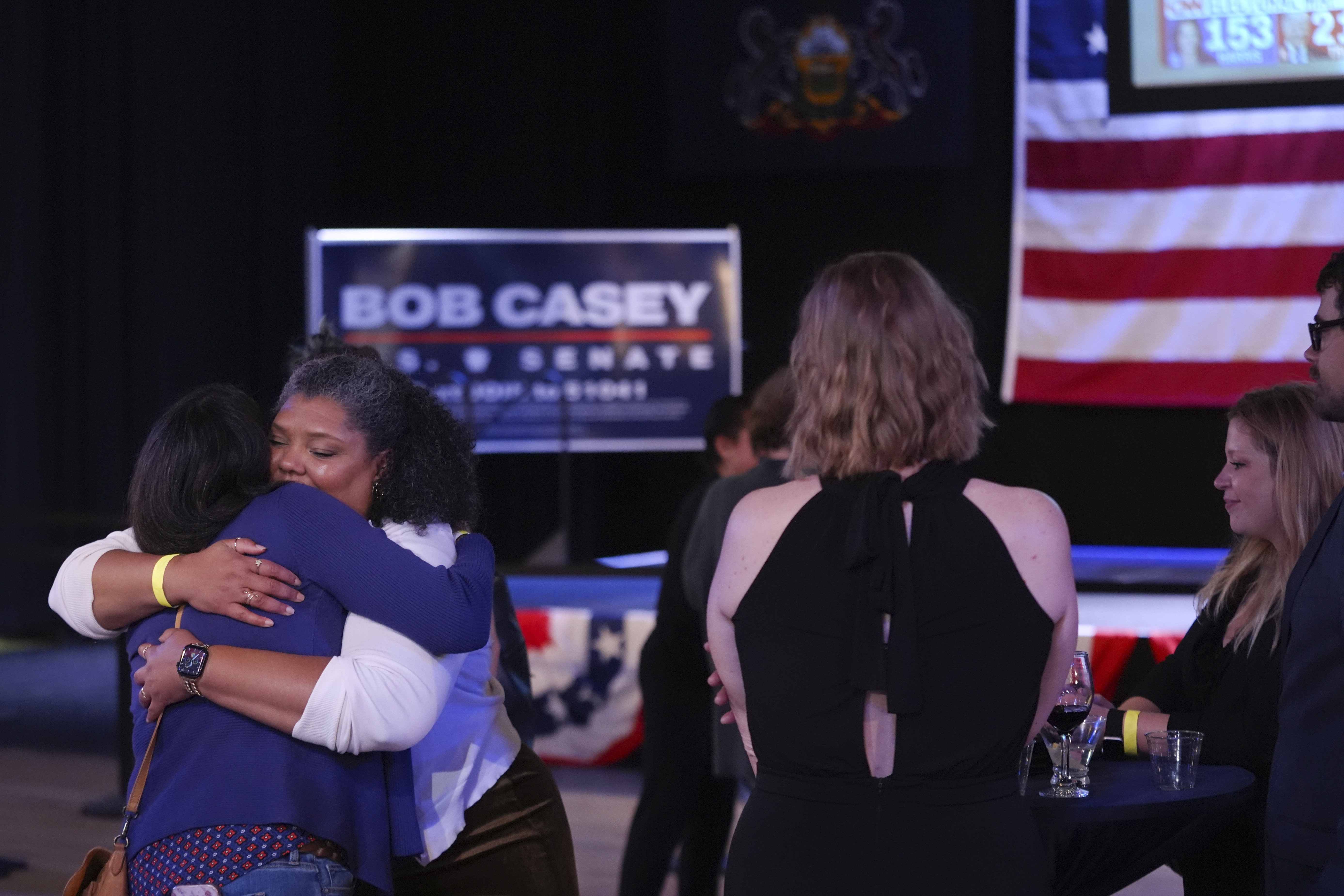 Supporters hug goodbye as they prepare to leave an election night watch party for Sen. Bob Casey, D-Pa., Tuesday Nov. 5, 2024, in Scranton, Pa. (AP Photo/Chris Szagola)