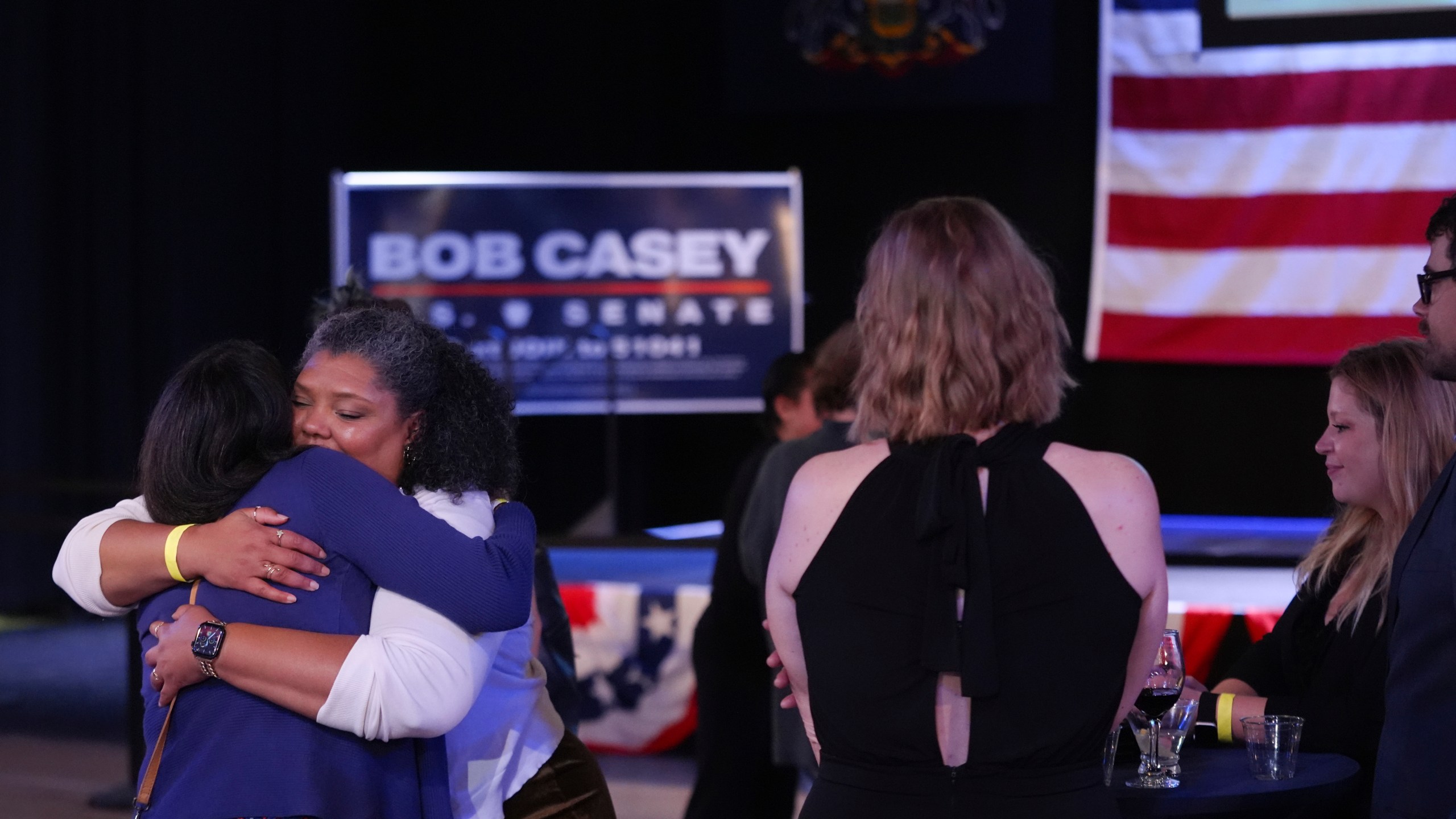 Supporters hug goodbye as they prepare to leave an election night watch party for Sen. Bob Casey, D-Pa., Tuesday Nov. 5, 2024, in Scranton, Pa. (AP Photo/Chris Szagola)