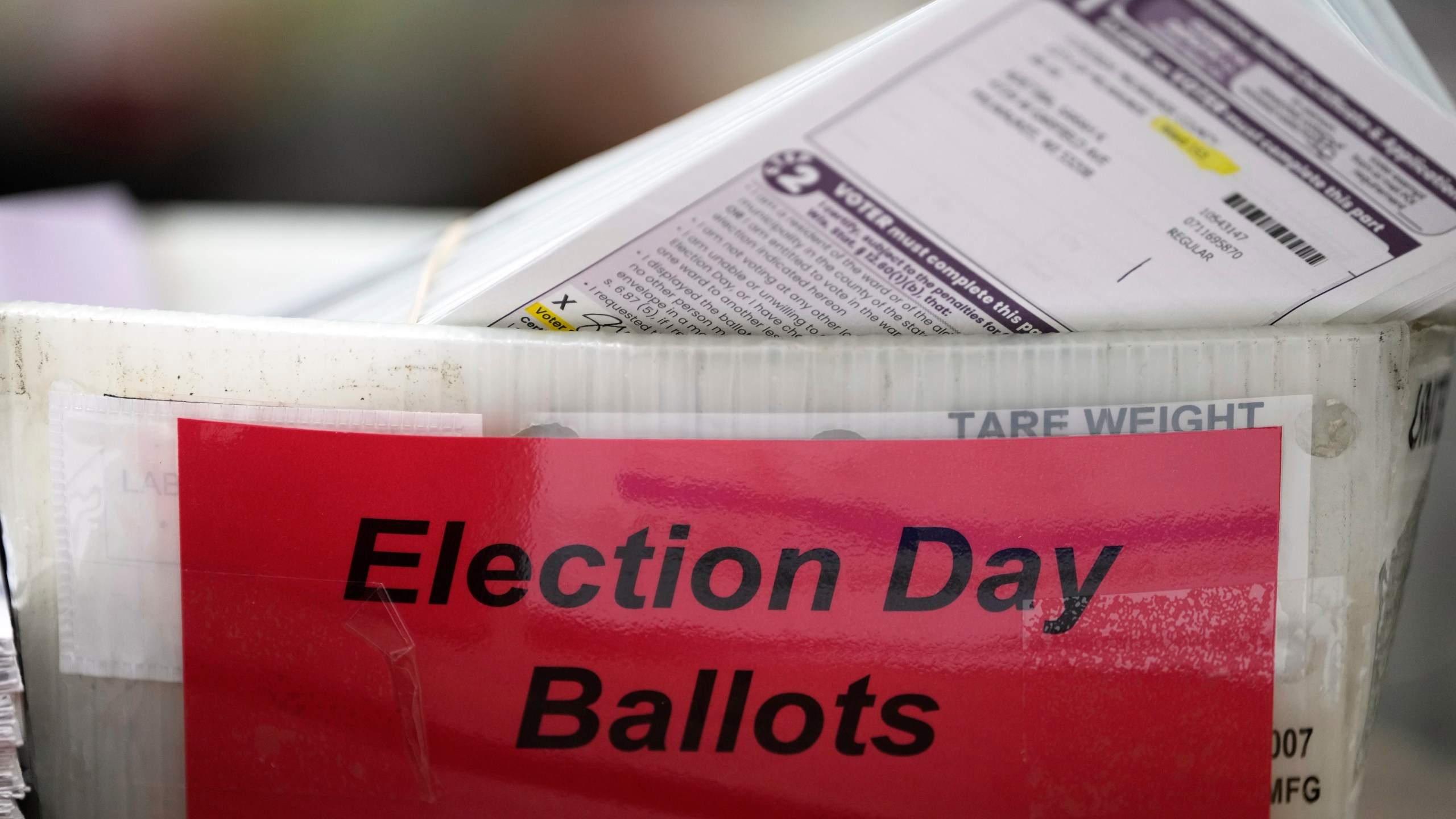 Cast ballots fill a tray, Tuesday, Nov. 5, 2024, in Milwaukee. (AP Photo/Morry Gash)