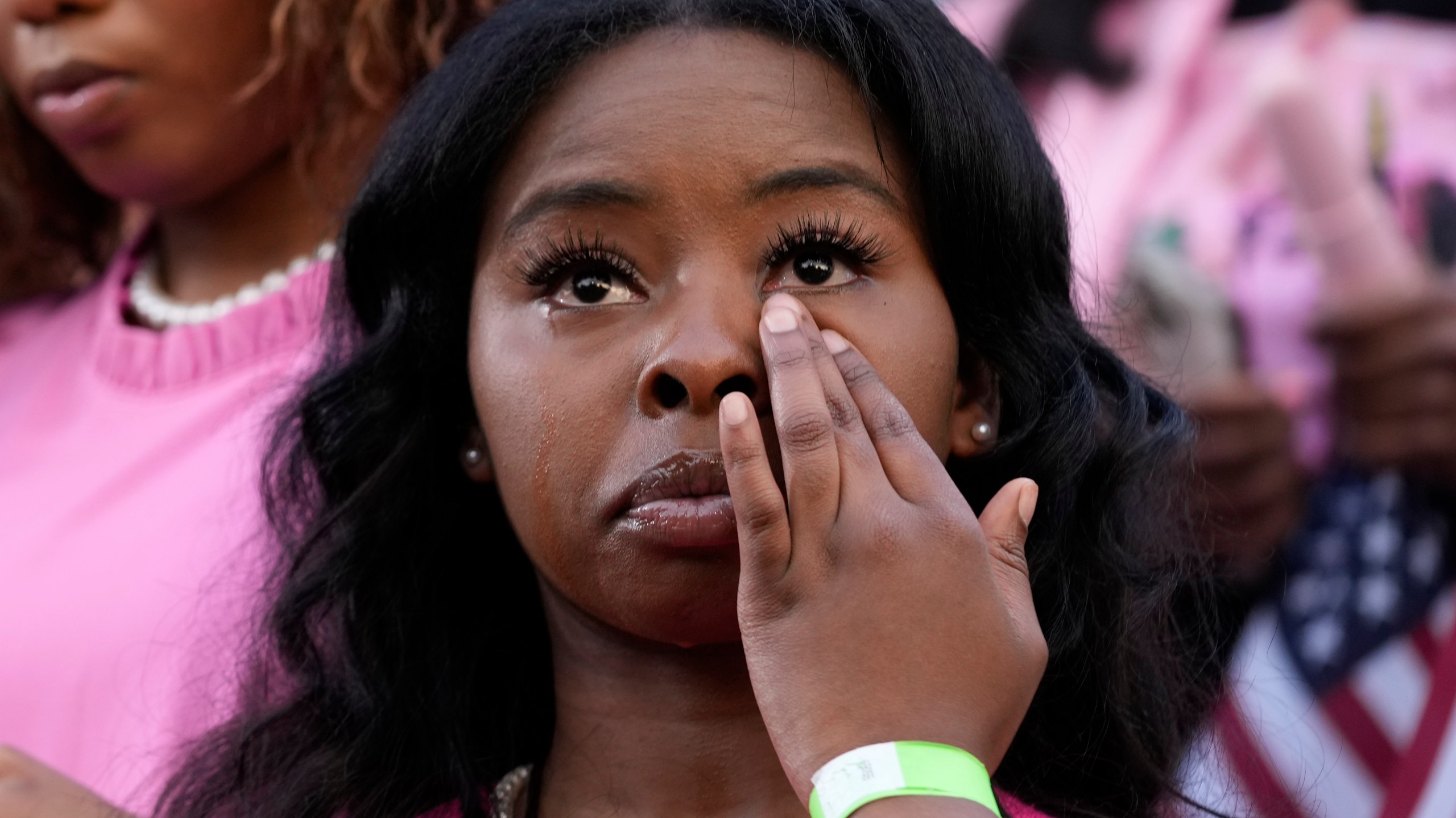 A supporter looks on as Vice President Kamala Harris delivers a concession speech for the 2024 presidential election, Wednesday, Nov. 6, 2024, on the campus of Howard University in Washington. (AP Photo/Susan Walsh)