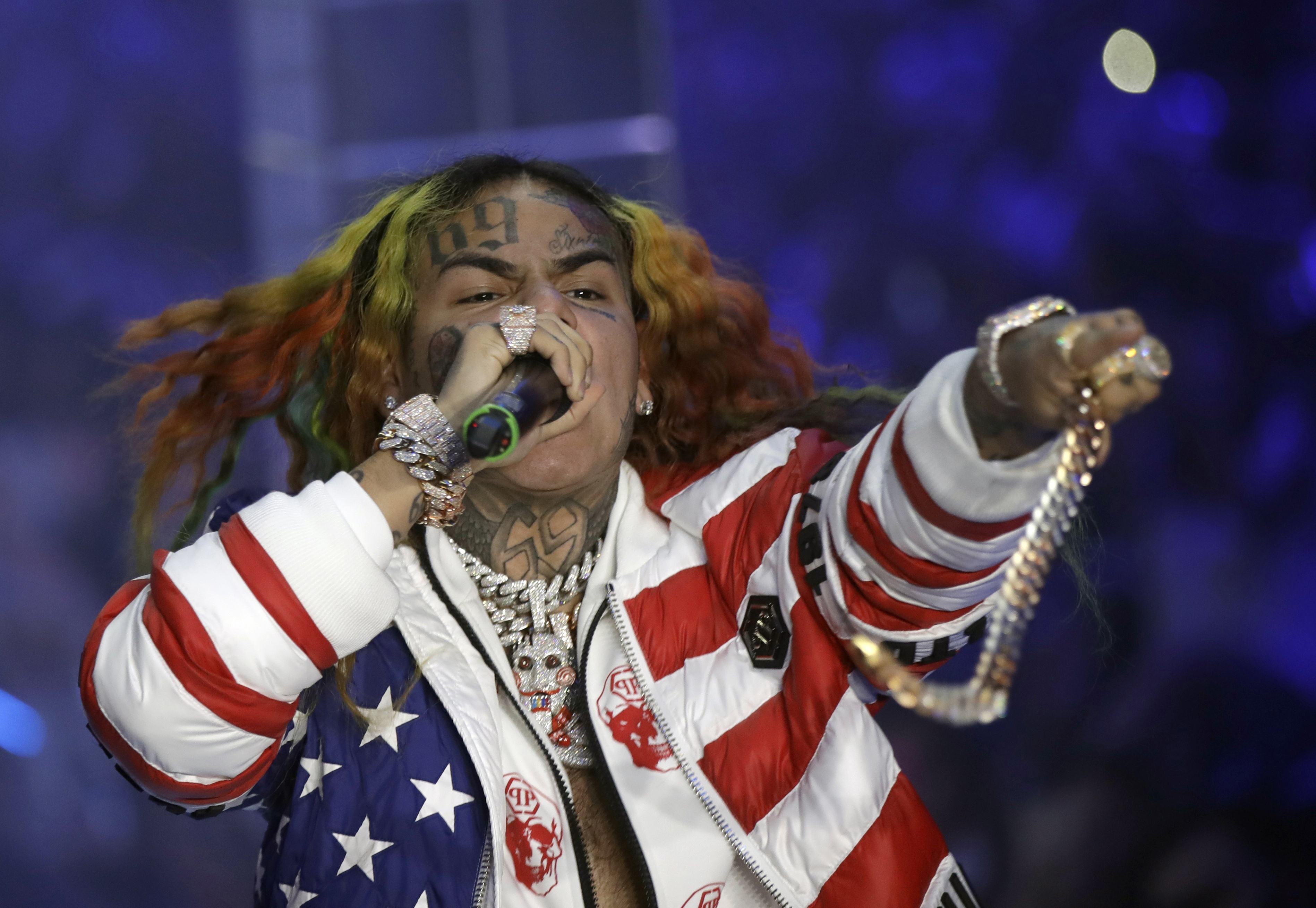 FILE- Rapper Daniel Hernandez, known as Tekashi 6ix9ine, performs during the Philipp Plein women's 2019 Spring-Summer collection, unveiled during the Fashion Week in Milan, Italy, Sept. 21, 2018. (AP Photo/Luca Bruno, File)