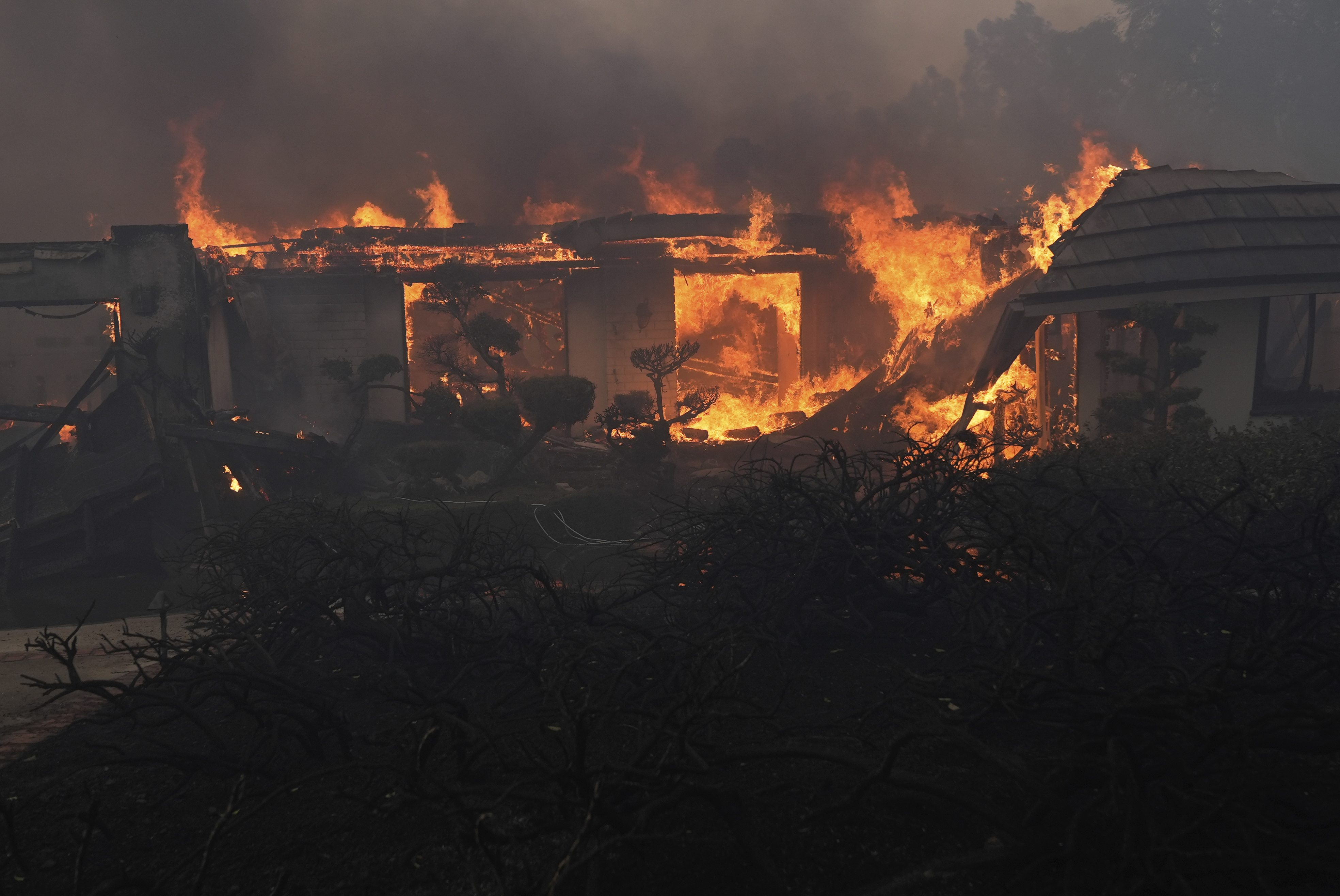 A home burns in the Mountain fire, Wednesday, Nov. 6, 2024, near Camarillo, Calif. (AP Photo/Marcio Jose Sanchez)