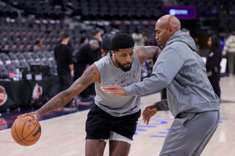 Philadelphia 76ers forward Paul George, left, warms up before an NBA basketball game against the Los Angeles Clippers, Wednesday, Nov. 6, 2024, in Inglewood, Calif. (AP Photo/Ryan Sun)