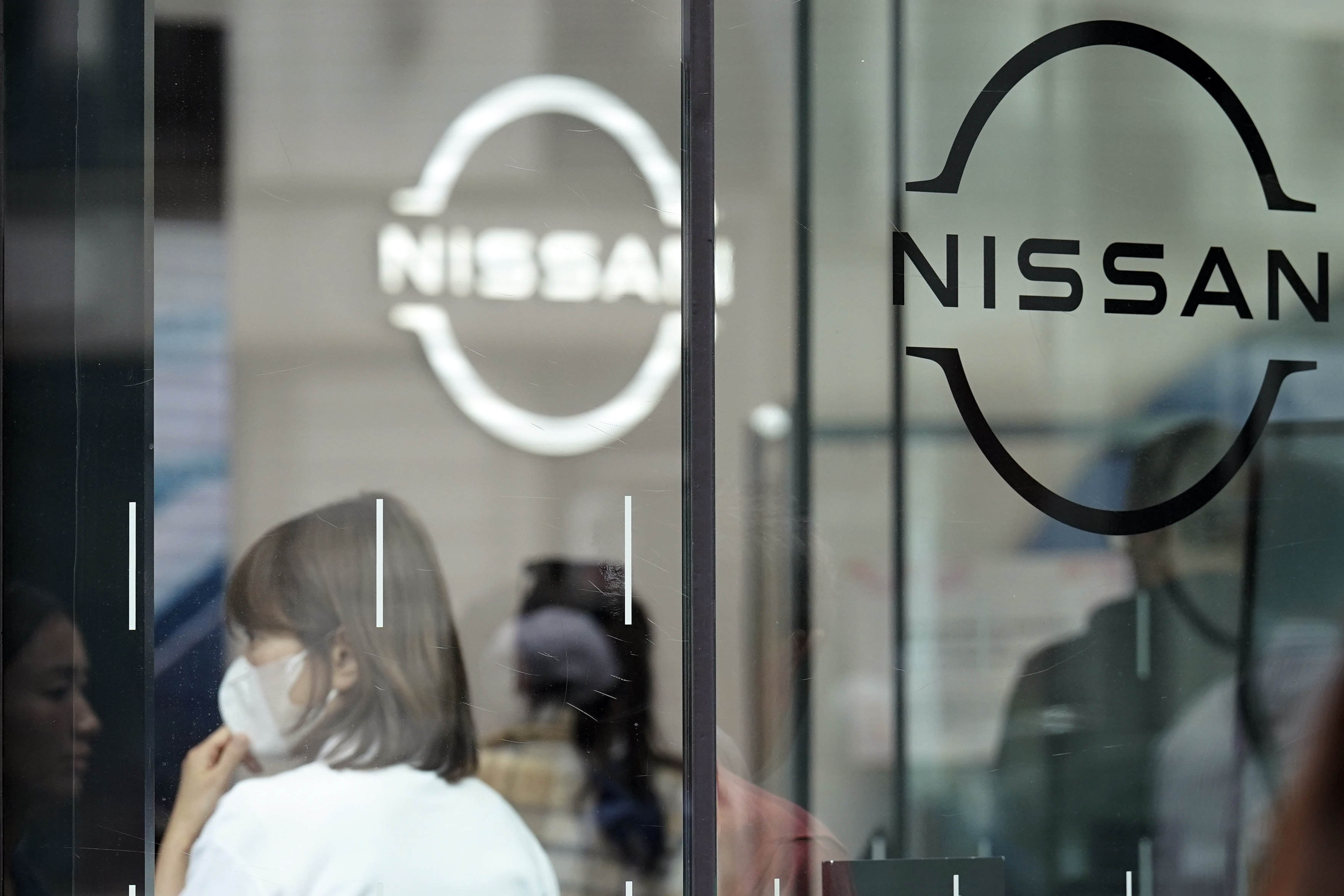 FILE - Logos at a Nissan showroom are seen in Ginza shopping district in Tokyo, on March 31, 2023. (AP Photo/Eugene Hoshiko, File)