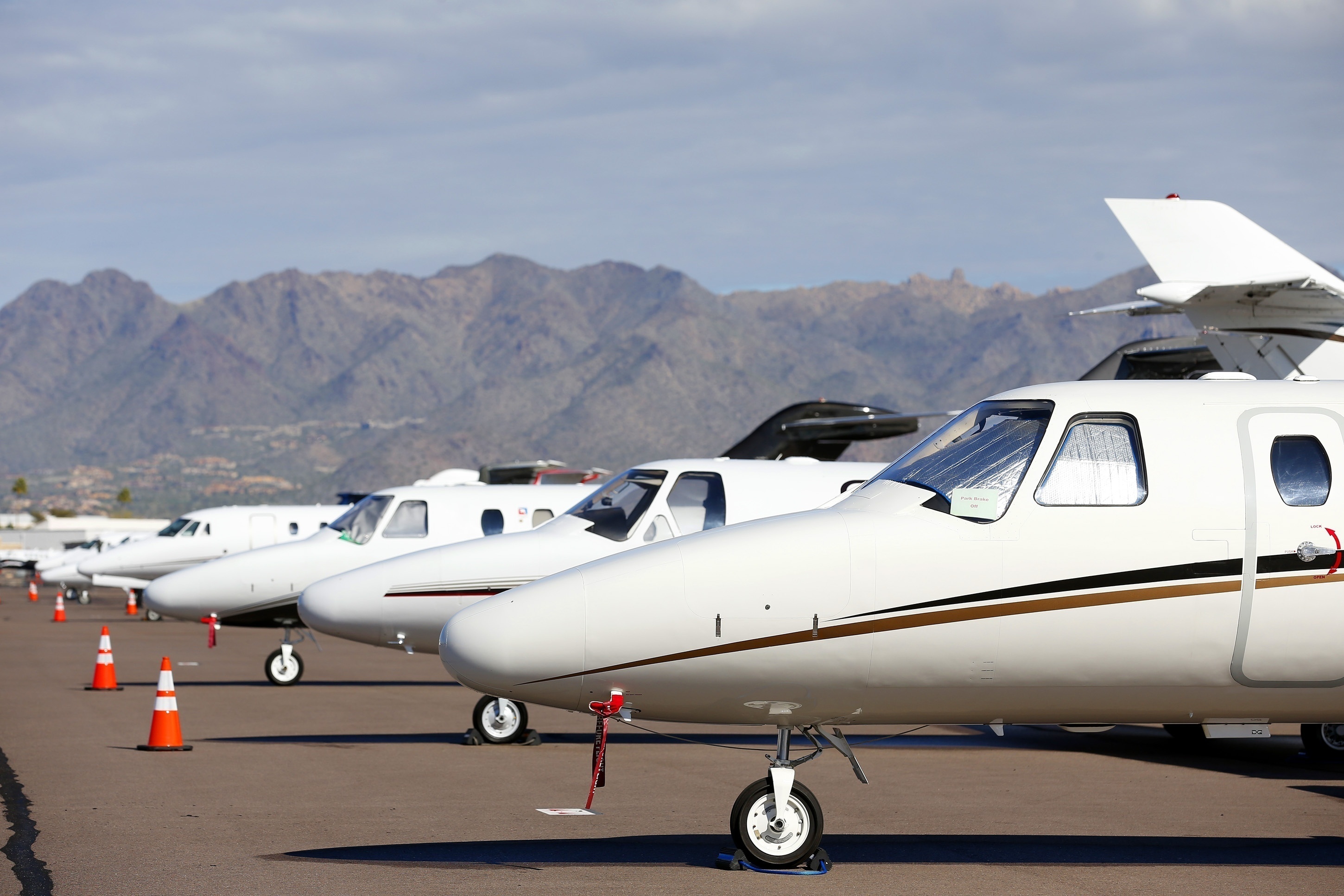 FILE - Private jets sit parked at Scottsdale Airport on Jan. 27, 2015, in Scottsdale, Ariz. (AP Photo/Ross D. Franklin, File)