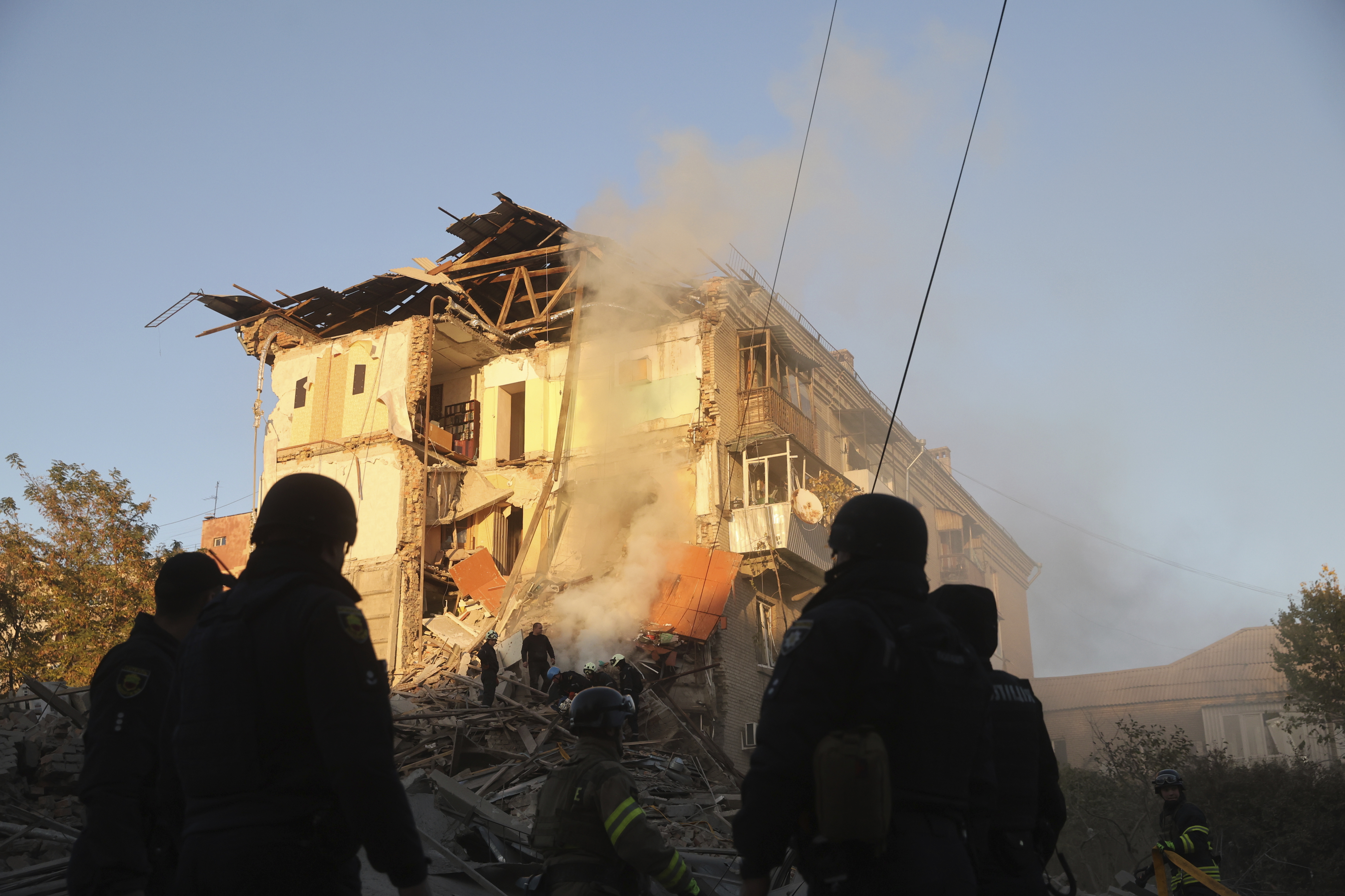 Rescue workers clear the rubble of a residential building destroyed by a Russian airstrike in Zaporizhzhia, Ukraine, Thursday, Nov. 7, 2024. (AP Photo/Kateryna Klochko)