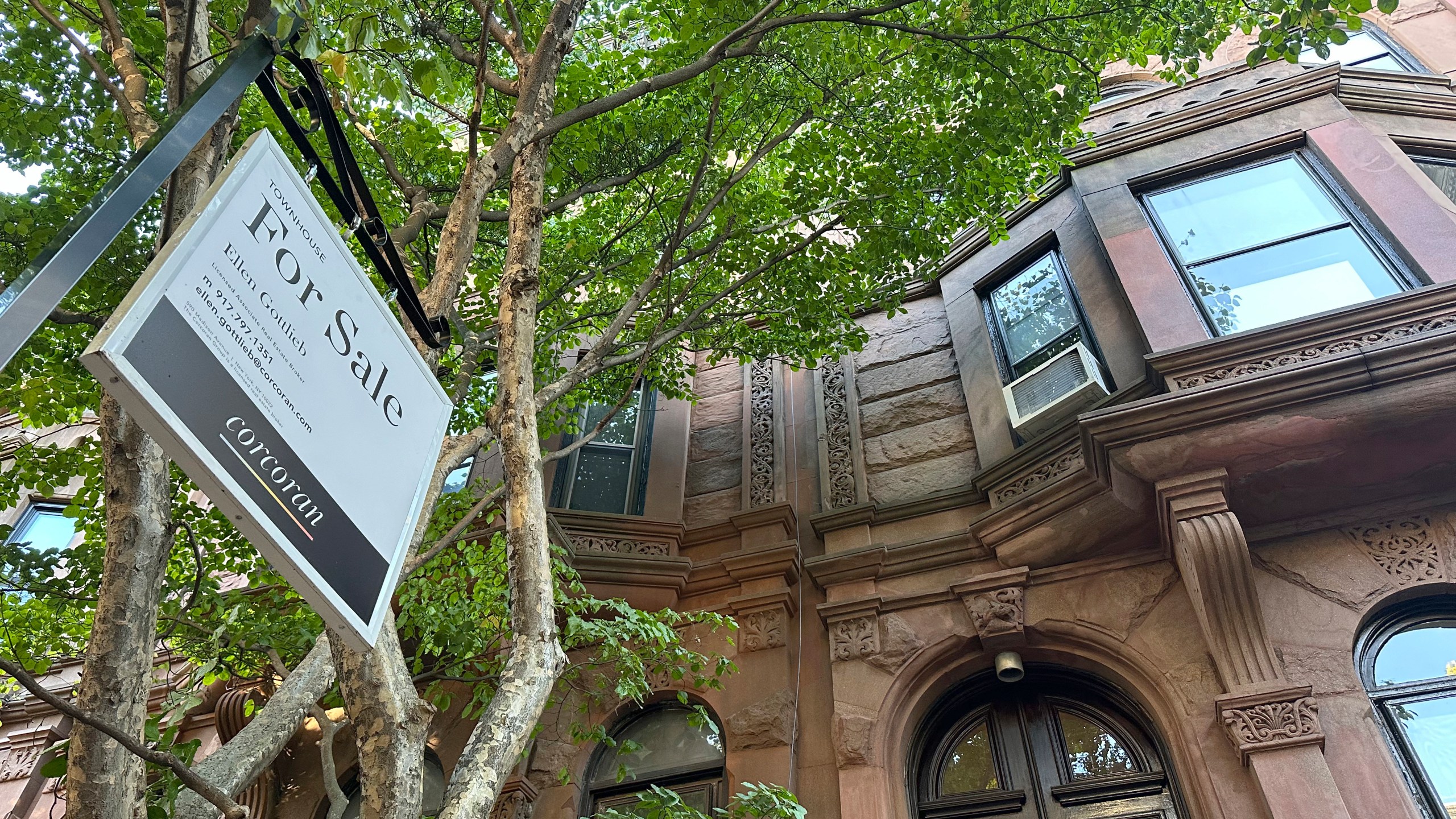 FILE - A for sale sign hangs in front of a home in the Park Slope neighborhood in the borough of Brooklyn in New York on Oct. 10, 2024. (AP Photo/Peter Morgan, File)