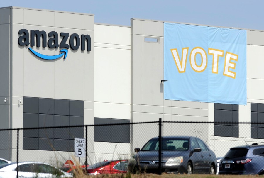 FILE - In this March 30, 2021 file photo, a banner encouraging workers to vote in labor balloting is shown at an Amazon warehouse in Bessemer, Ala. (AP Photo/Jay Reeves, File)