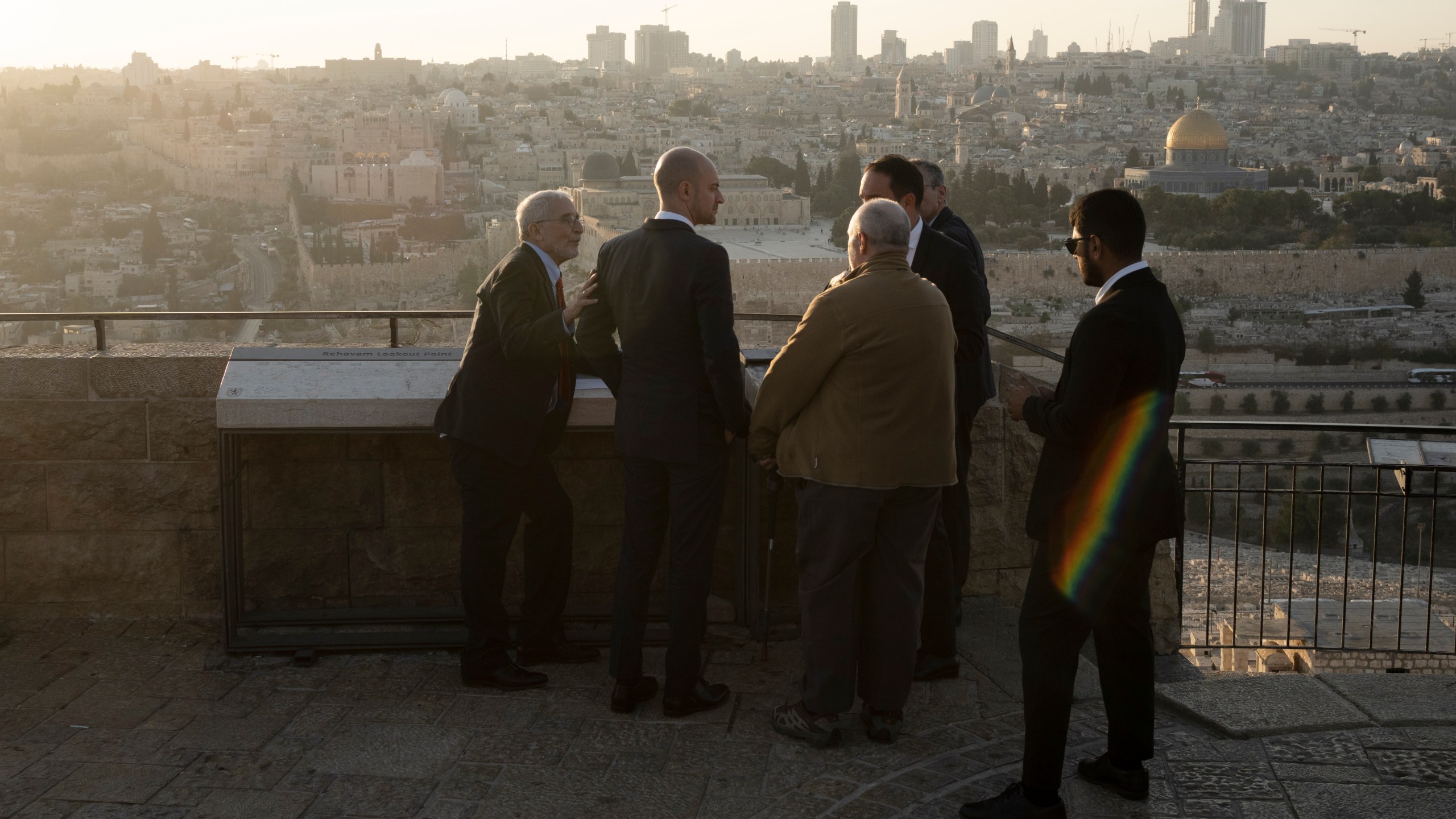 French Foreign Minister Jean-Noël Barrot, second from left, joined by by Daniel Seidemann, left, overlook the Old City from the Mount of Olives during his visit to Jerusalem, Thursday, Nov. 7, 2024. (AP Photo/Maya Alleruzzo)