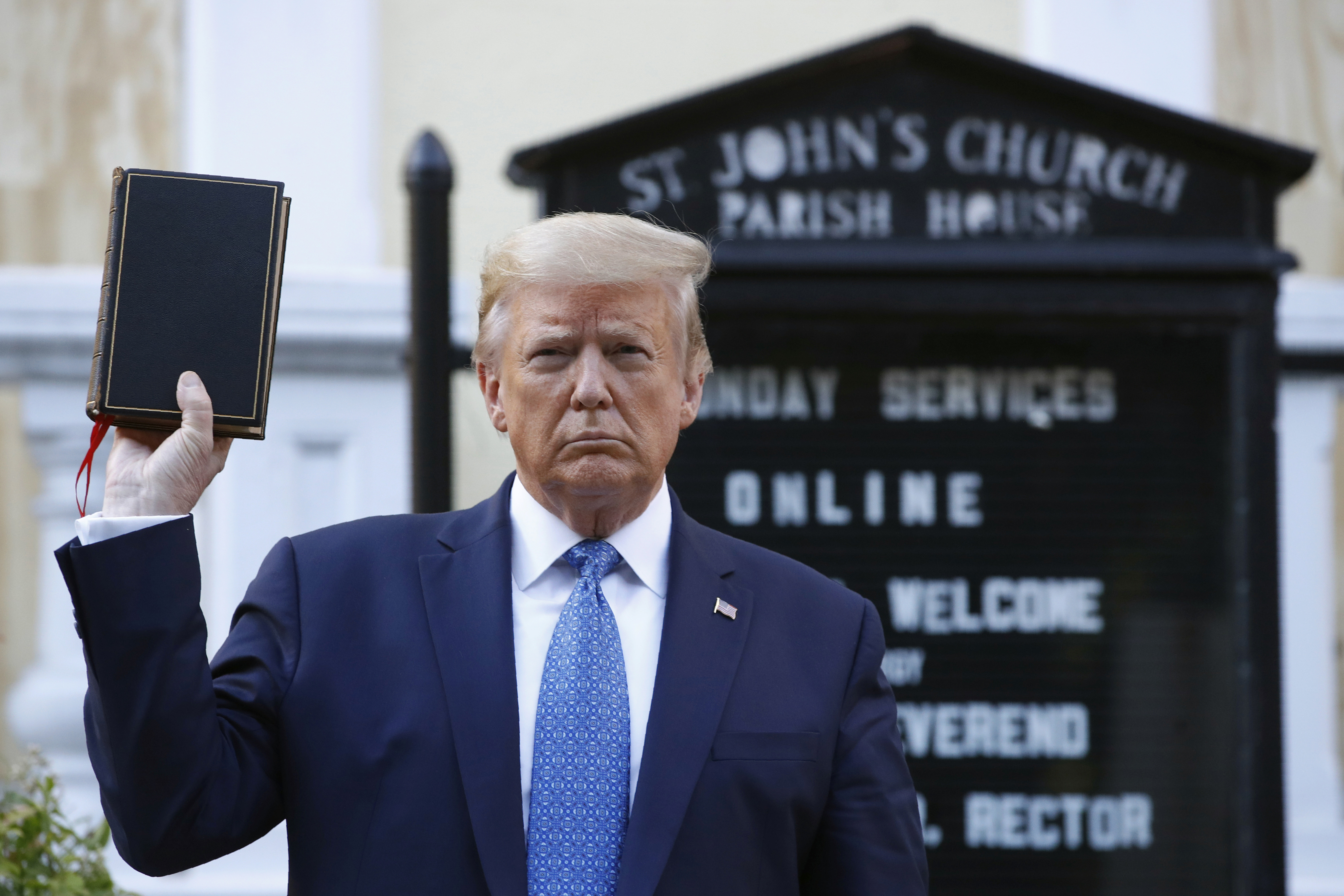 FILE - President Donald Trump holds a Bible as he visits outside St. John's Church, June 1, 2020, in Washington. (AP Photo/Patrick Semansky, File)