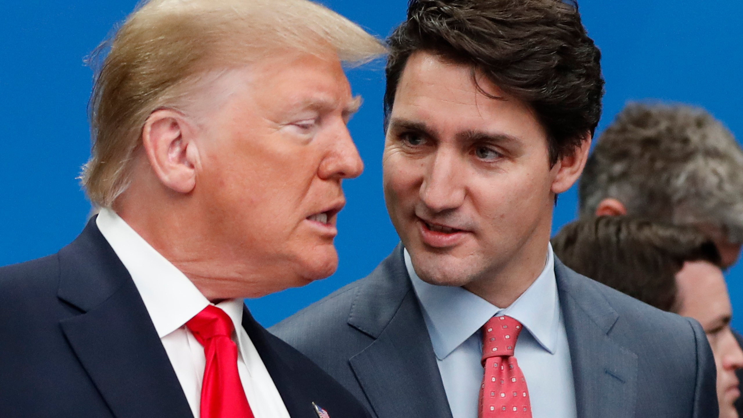 FILE - U.S. President Donald Trump, left, and Canadian Prime Minister Justin Trudeau talk prior to a NATO round table meeting at The Grove hotel and resort in Watford, Hertfordshire, England, Dec. 4, 2019. (AP Photo/Frank Augstein, File)