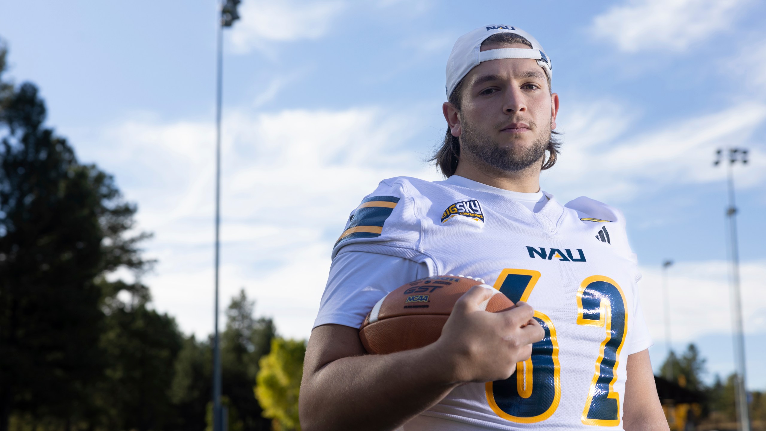 Northern Arizona University's Jonny Bottorff took advantage of new NIL money making opportunities and rebooted his college football career. Bottorff poses for a photo on the campus on NAU on Monday, Oct. 28, 2024, in Flagstaff, Ariz. (AP Photo/Josh Biggs)