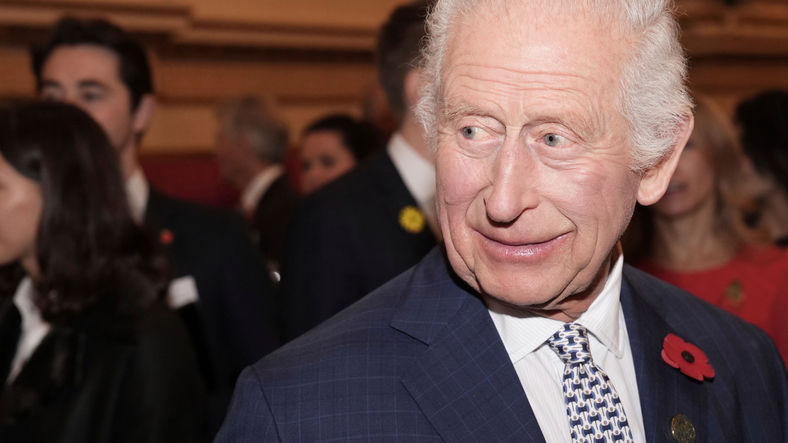 Britain's King Charles III meets guests during an International Sustainability reception at Buckingham Palace in London, Wednesday Nov. 6, 2024. (Jordan Pettitt/Pool via AP)