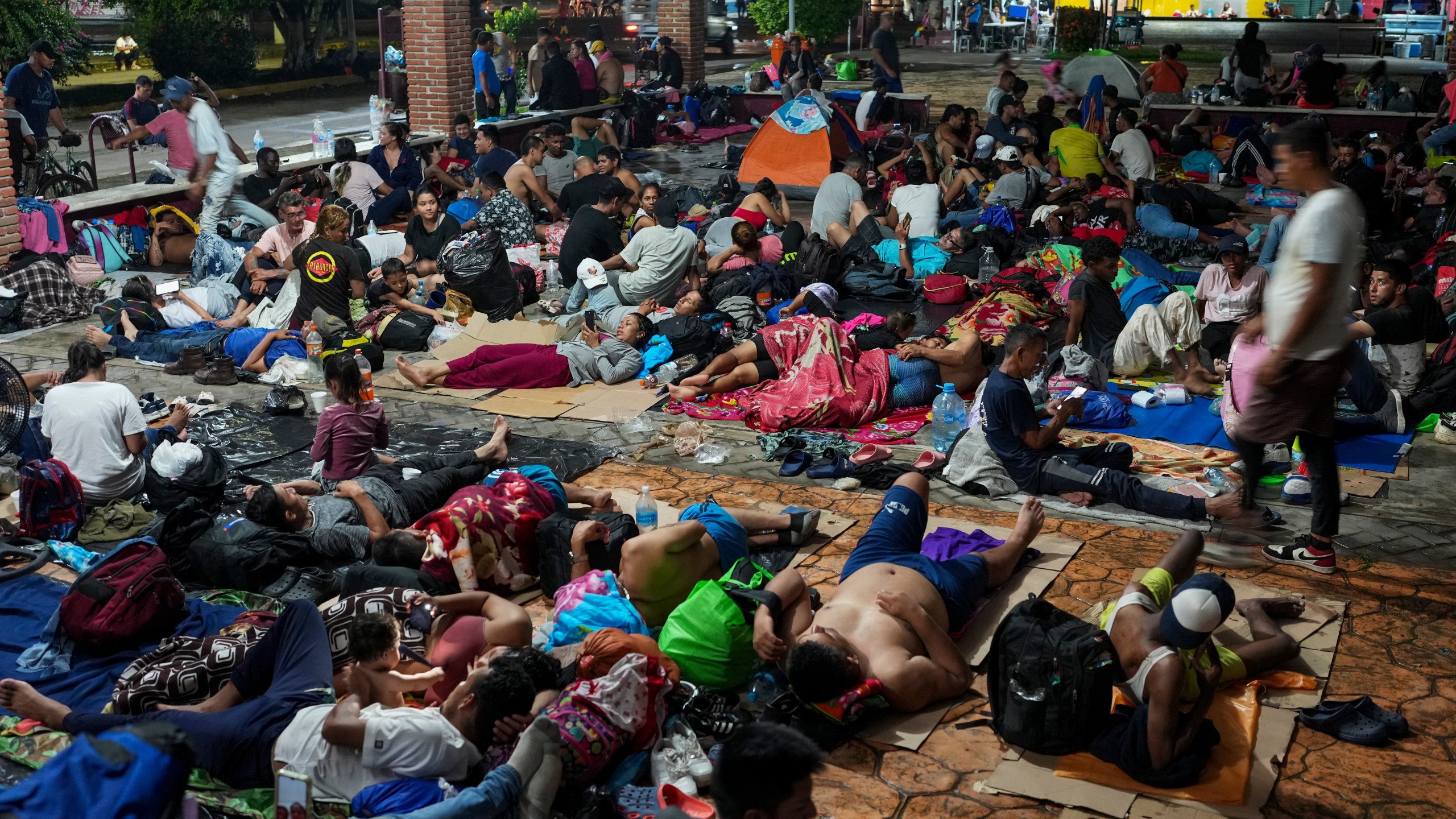 Migrants camp after a day's walk from Tapachula, Mexico, hoping to reach the country's northern border and ultimately the United States, on Tuesday, Nov. 5, 2024 (AP Photo/Moises Castillo)