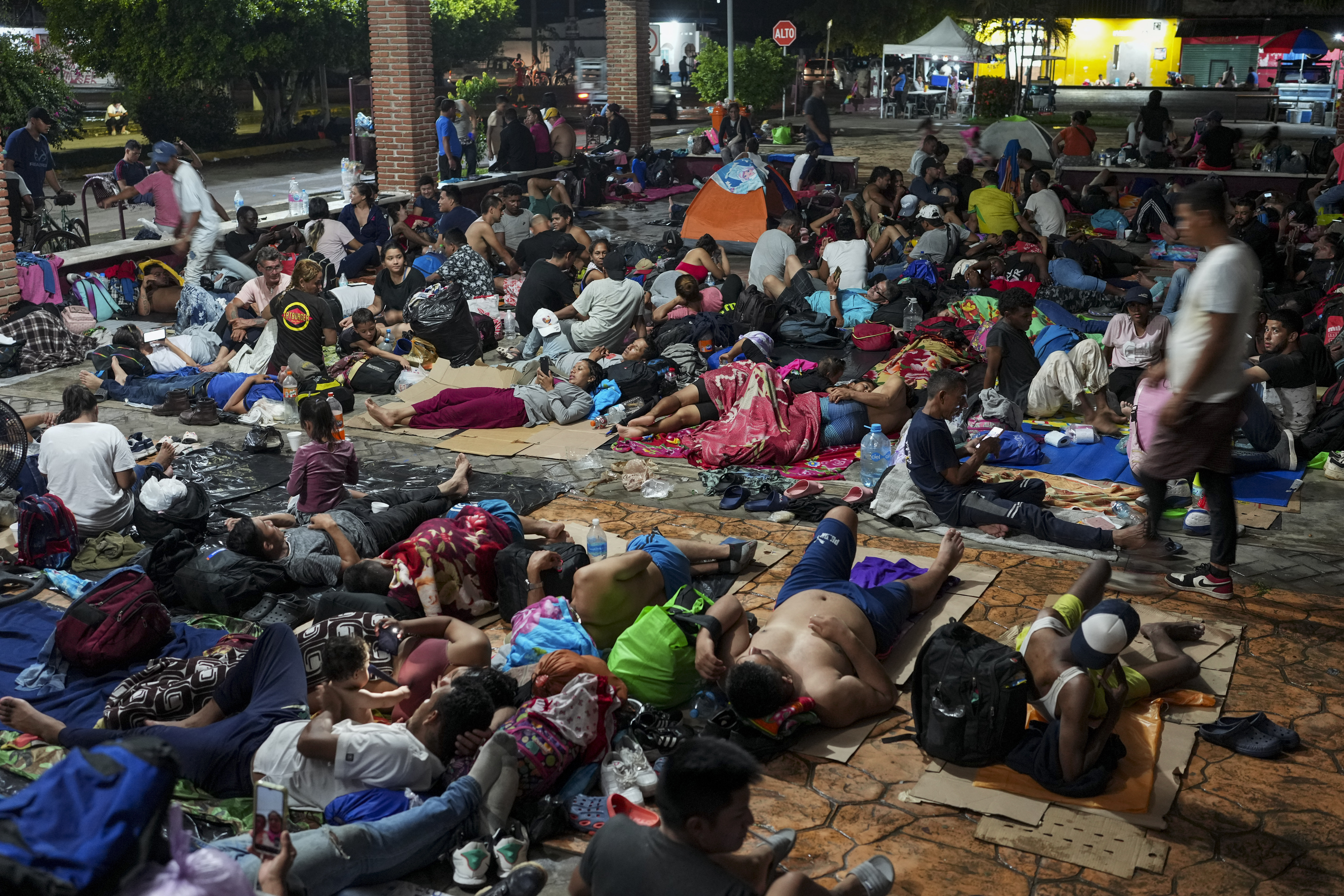 Migrants camp after a day's walk from Tapachula, Mexico, hoping to reach the country's northern border and ultimately the United States, on Tuesday, Nov. 5, 2024 (AP Photo/Moises Castillo)