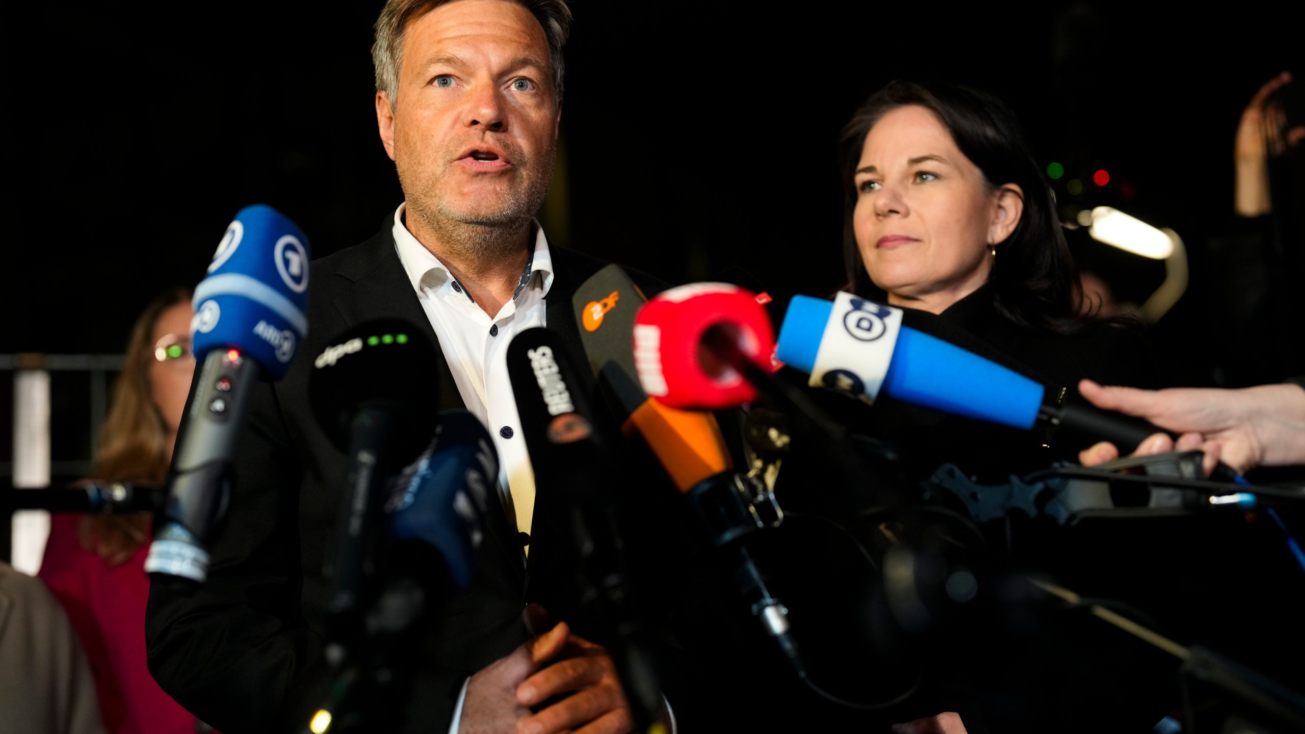 German Vice Chancellor and Economy and Climate Minister Robert Habeck, left, Foreign Minister Annalena Baerbocka brief the media after a meeting of German government leaders at the chancellery in Berlin, Germany, Wednesday, Nov. 6, 2024. (AP Photo/Markus Schreiber)