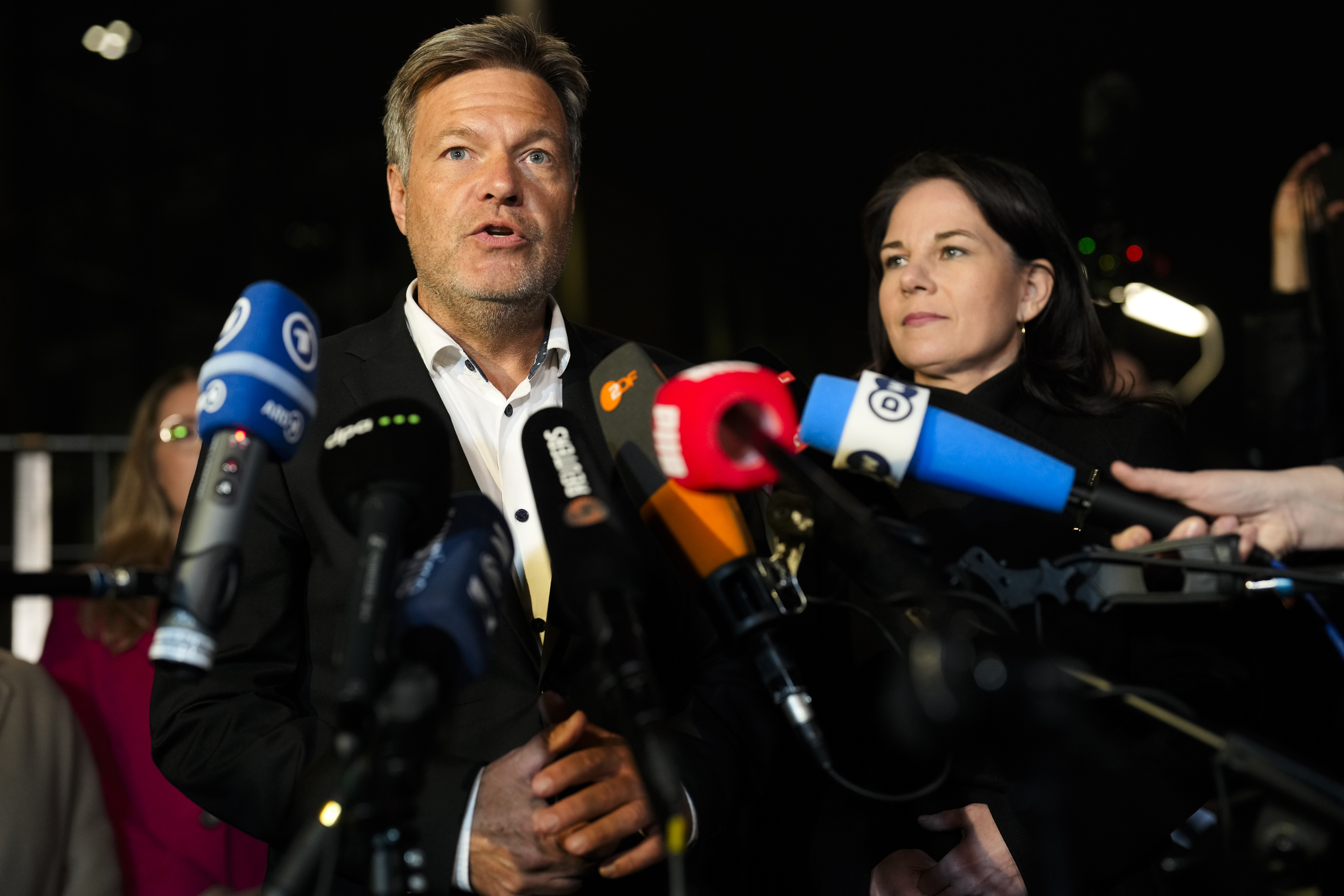 German Vice Chancellor and Economy and Climate Minister Robert Habeck, left, Foreign Minister Annalena Baerbocka brief the media after a meeting of German government leaders at the chancellery in Berlin, Germany, Wednesday, Nov. 6, 2024. (AP Photo/Markus Schreiber)