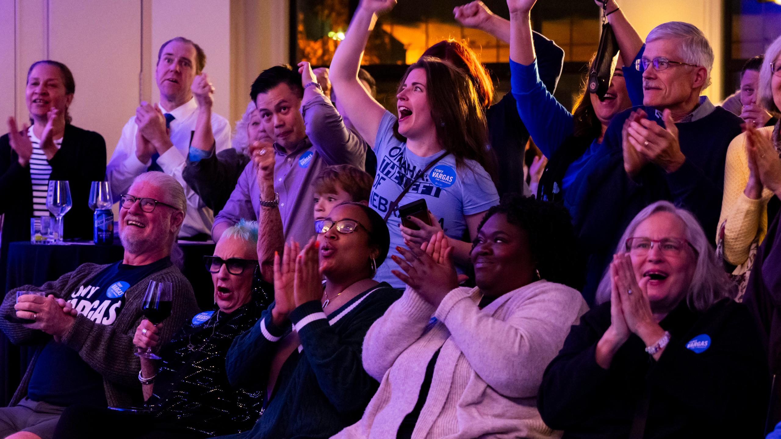 Attendees cheer as the first results shown show state Sen. Tony Vargas leading over U.S. Rep. Don Bacon during an election night watch party for Vargas, Tuesday, Nov. 5, 2024, at the Kimpton Cottonwood Hotel in Omaha, Neb.(Megan Nielsen/Omaha World-Herald via AP)