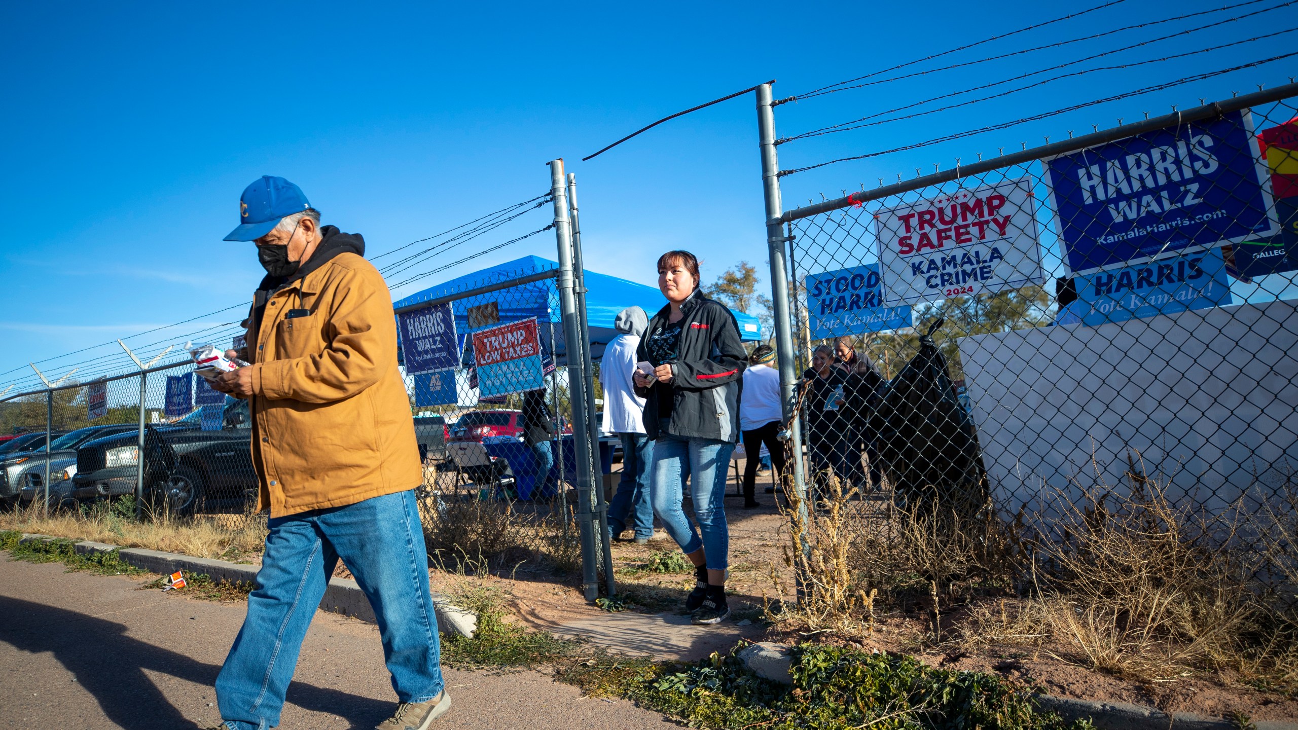 Voters arrive to a polling station on the Navajo Nation in Fort Defiance, Ariz., on Election Day, Tuesday, Nov. 5, 2024. (AP Photo/Andres Leighton)