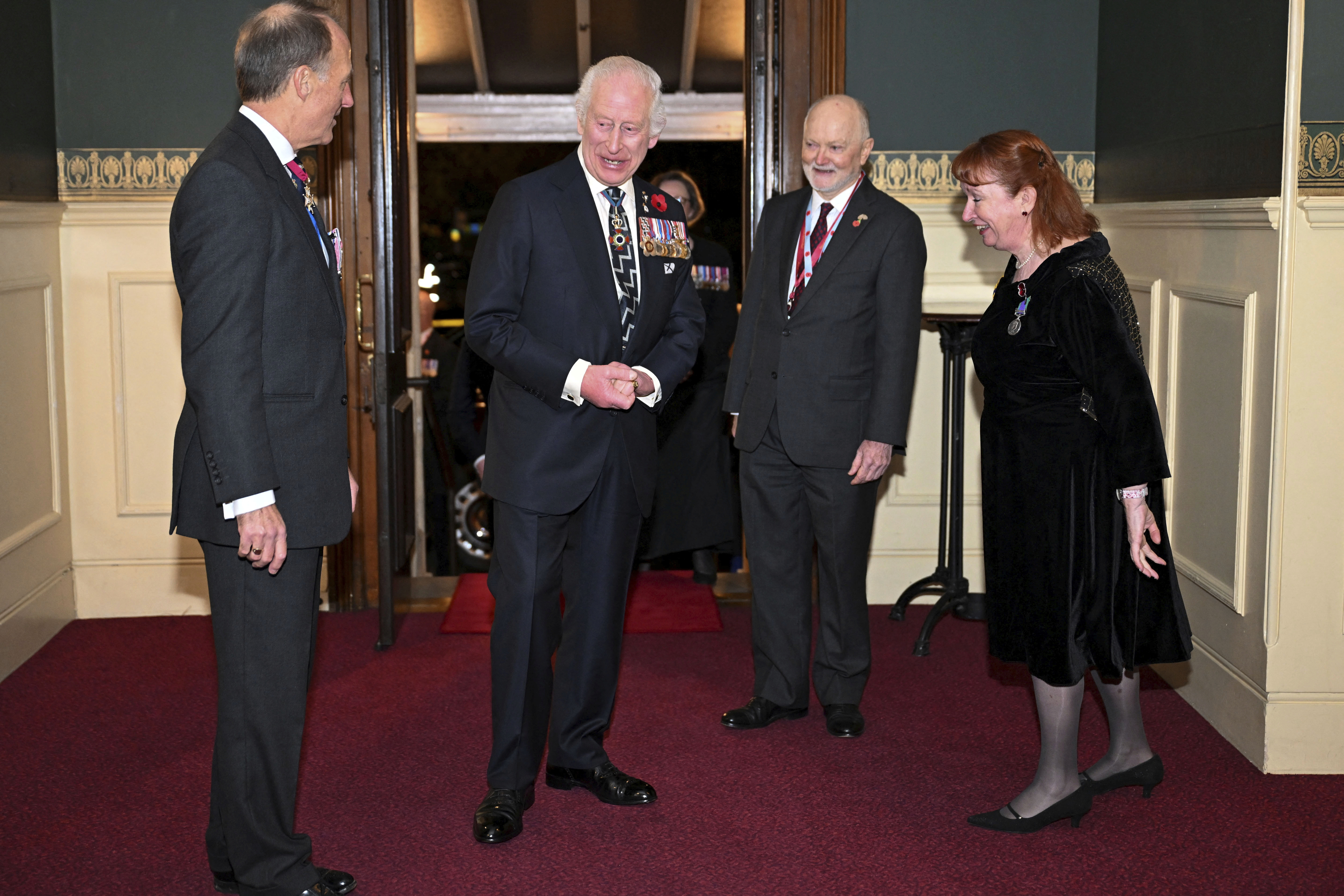 Britain's King Charles, centre left, arrives to attend the Royal British Legion Festival of Remembrance at the Royal Albert Hall in London, Saturday Nov. 9, 2024. (Chris J. Ratcliffe/Pool Photo via AP)