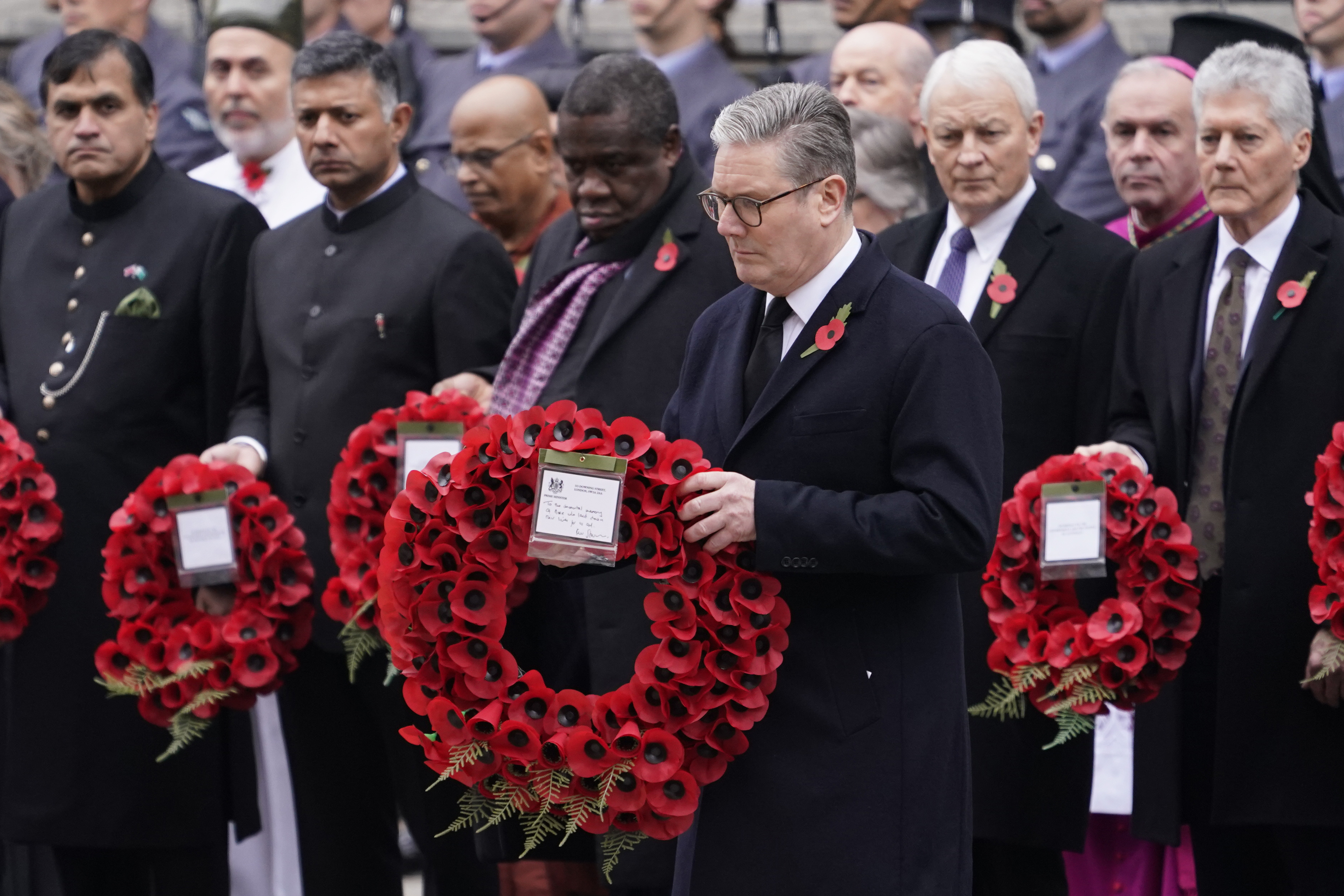 Britain's Prime Minister Keir Starmer lays a wreath during the Remembrance Sunday Service at the Cenotaph in London, Sunday, Nov. 10, 2024. (AP Photo/Alberto Pezzali)