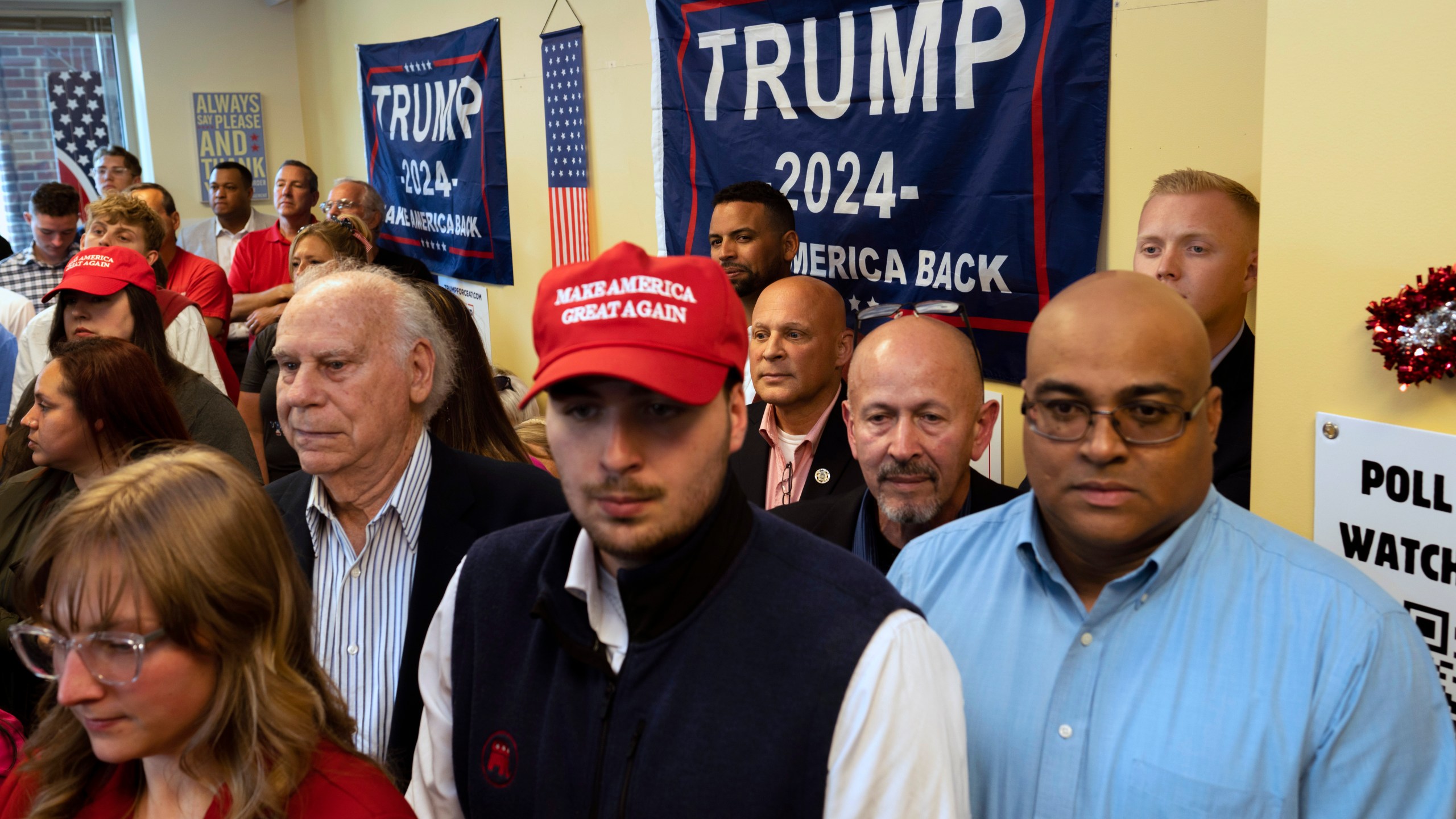 FILE - Attendees gather as the "Latino Americans for Trump" office opens in Reading, Pa., June 12, 2024. (AP Photo/Joe Lamberti, File)