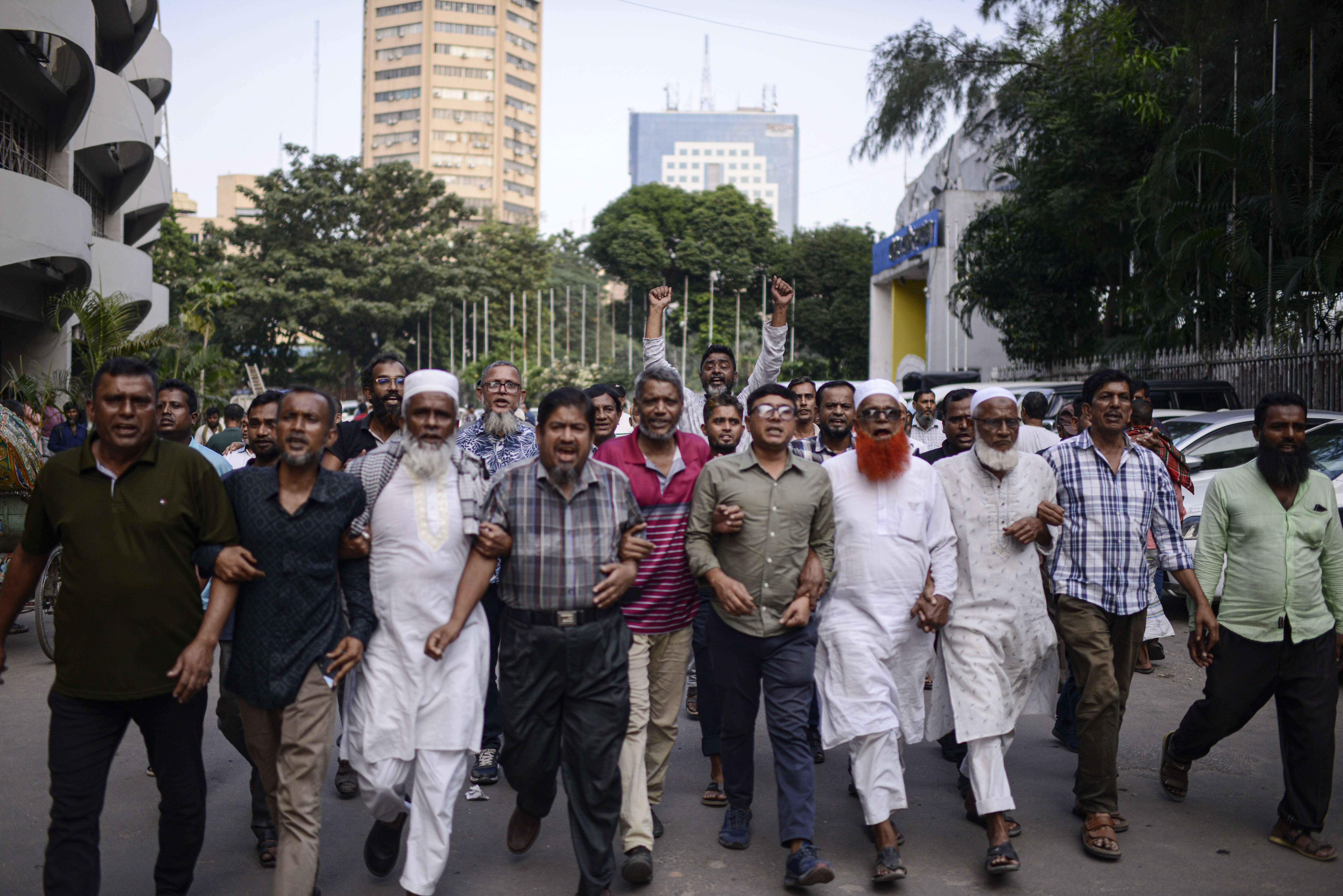 Bangladesh Nationalist Party activists shout slogans during a protest to counter former prime minister Sheikh Hassan's Awami League party rally in Dhaka, Bangladesh, Sunday, Nov. 10, 2024. (AP Photo/Mahmud Hossain Opu)