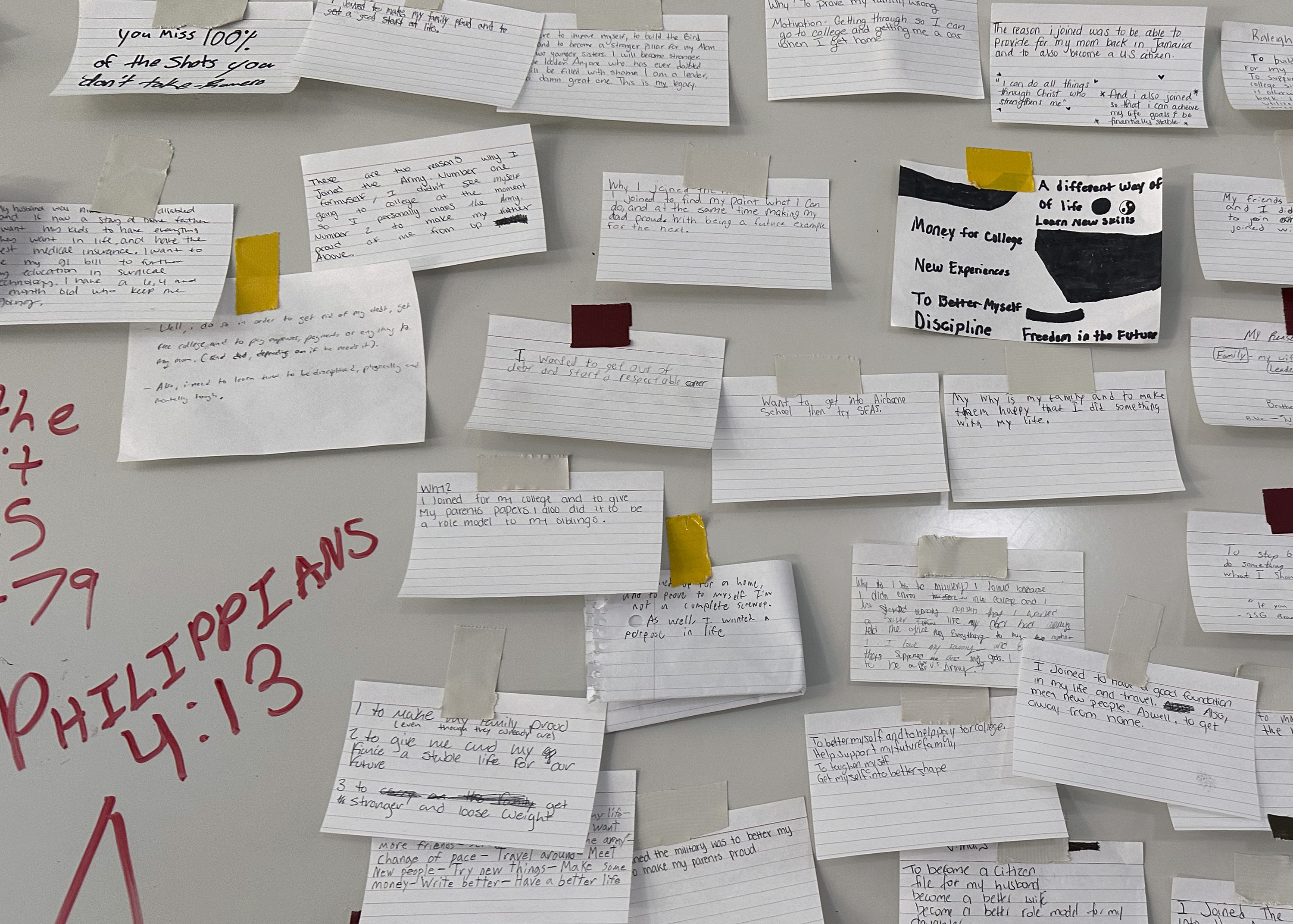 Index cards describing why the recruits joined the Army are taped to a large board on a wall at Fort Jackson, a U.S. Army Training Center, in Columbia, S.C., Sept. 25, 2024. (AP Photo/Lolita Baldor)