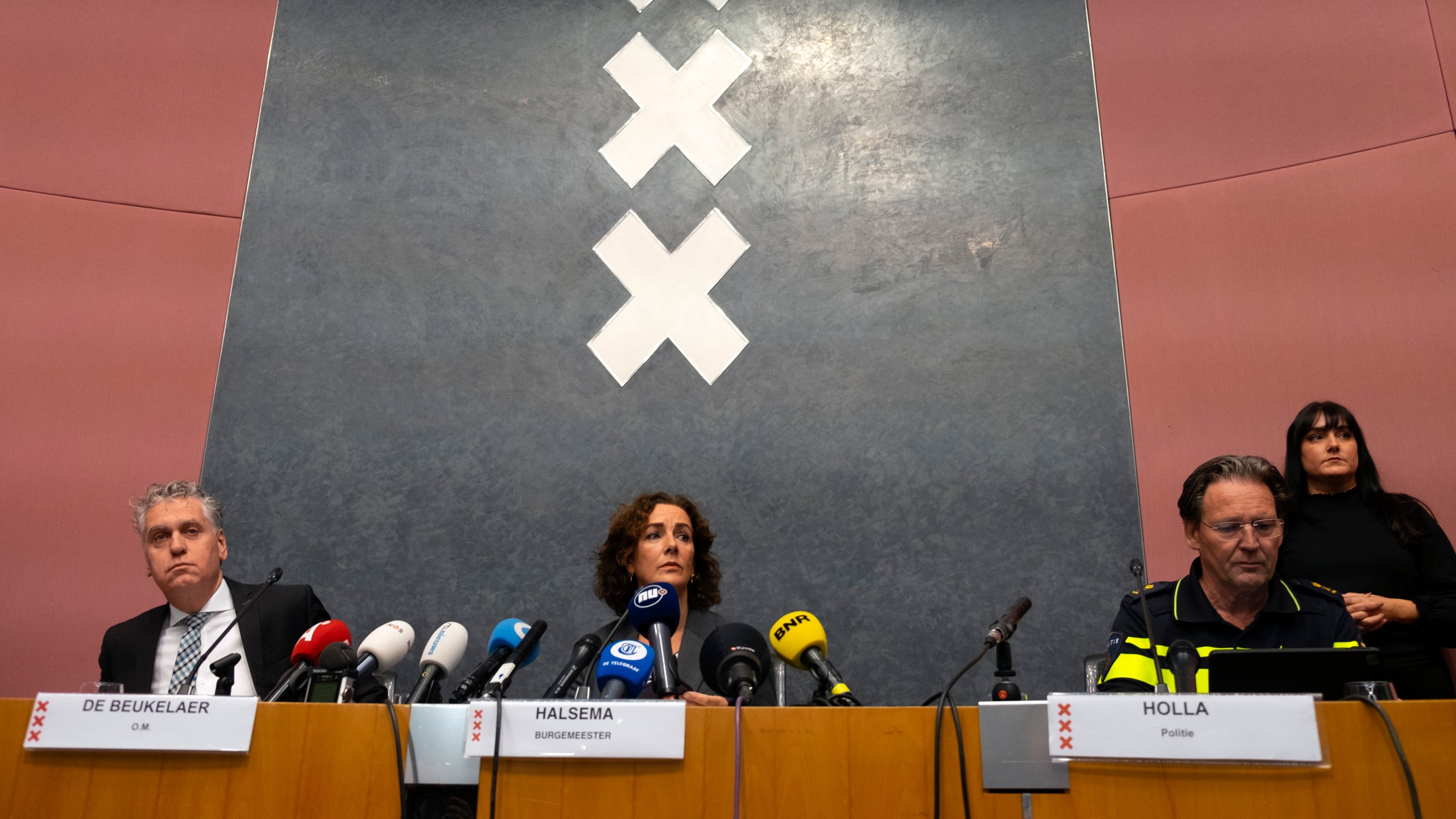 Amsterdam's Mayor Femke Halsema, centre, acting Amsterdam police chief Peter Holla, left, and head of the Amsterdam public prosecutor's office René de Beukelaer hold a news conference after Israeli fans and protesters clashed overnight after a soccer match, in Amsterdam, Netherlands, Friday Nov, 8, 2024. (AP Photo/Mike Corder)