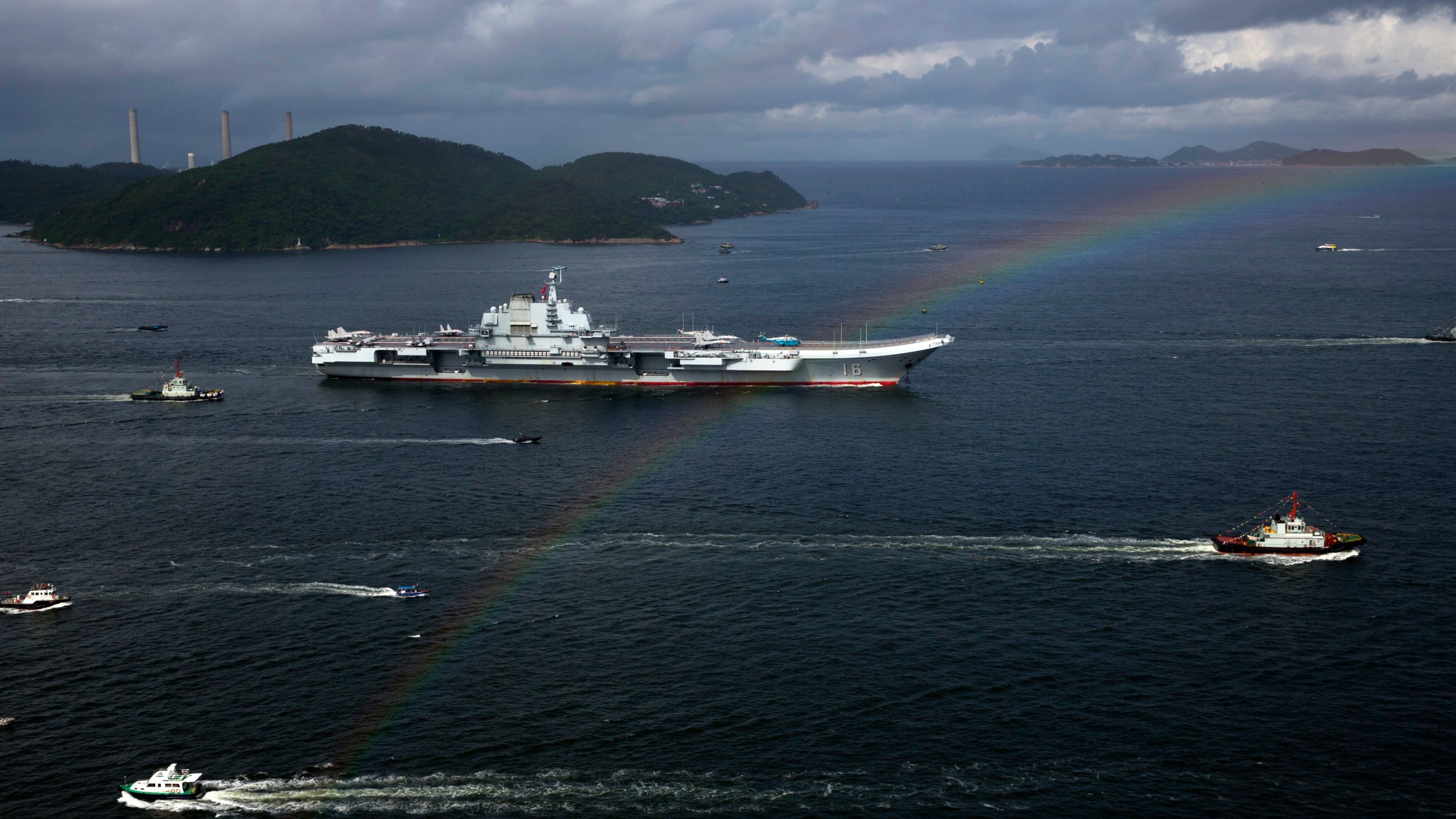 FILE- The Liaoning, China's first conventionally powered aircraft carrier, sails into Hong Kong for port call, on July 7, 2017, to celebrate the 20th anniversary of the People's Liberation Army (PLA) garrison's presence in the semi-autonomous Chinese city and former British colony. (AP Photo/Kin Cheung, File)