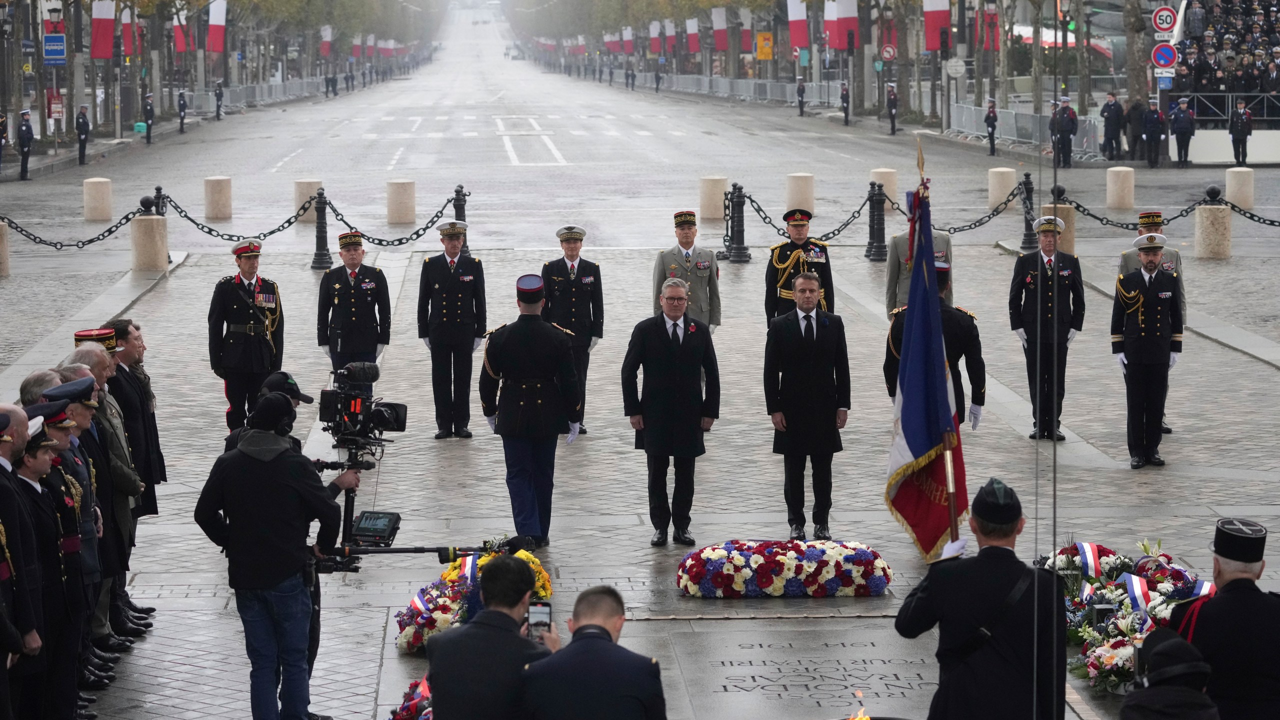 French President Emmanuel Macron, center right, and British Prime Minister Keir Starmer, center left, attend ceremonies marking the 106th anniversary of the Armistice, a celebration of their countries' friendship, as nations across the world pay tribute to their fallen soldiers in World War I, Monday, Nov. 11, 2024 at the Arc de Triomphe in Paris, (AP Photo/Michel Euler, Pool)