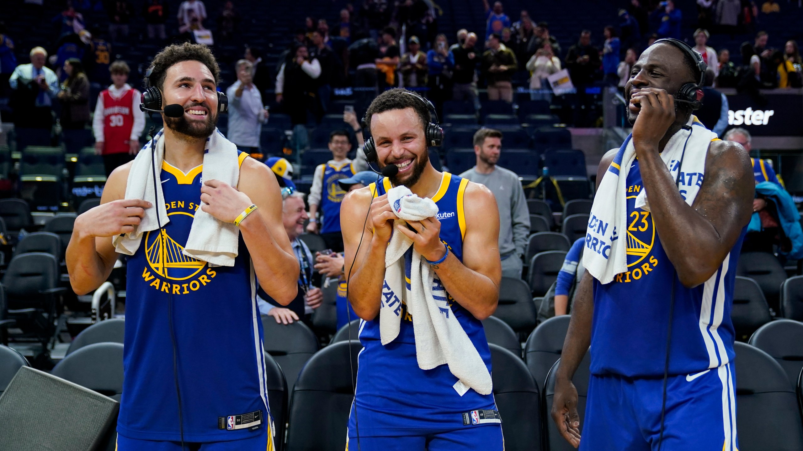 FILE - Golden State Warriors guards Klay Thompson, left, and Stephen Curry and forward Draymond Green, right, laugh while being interviewed, Nov. 30, 2023, in San Francisco. (AP Photo/Godofredo A. Vásquez, File)