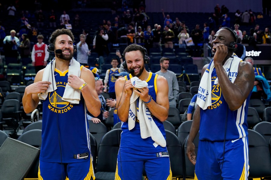 FILE - Golden State Warriors guards Klay Thompson, left, and Stephen Curry and forward Draymond Green, right, laugh while being interviewed, Nov. 30, 2023, in San Francisco. (AP Photo/Godofredo A. Vásquez, File)