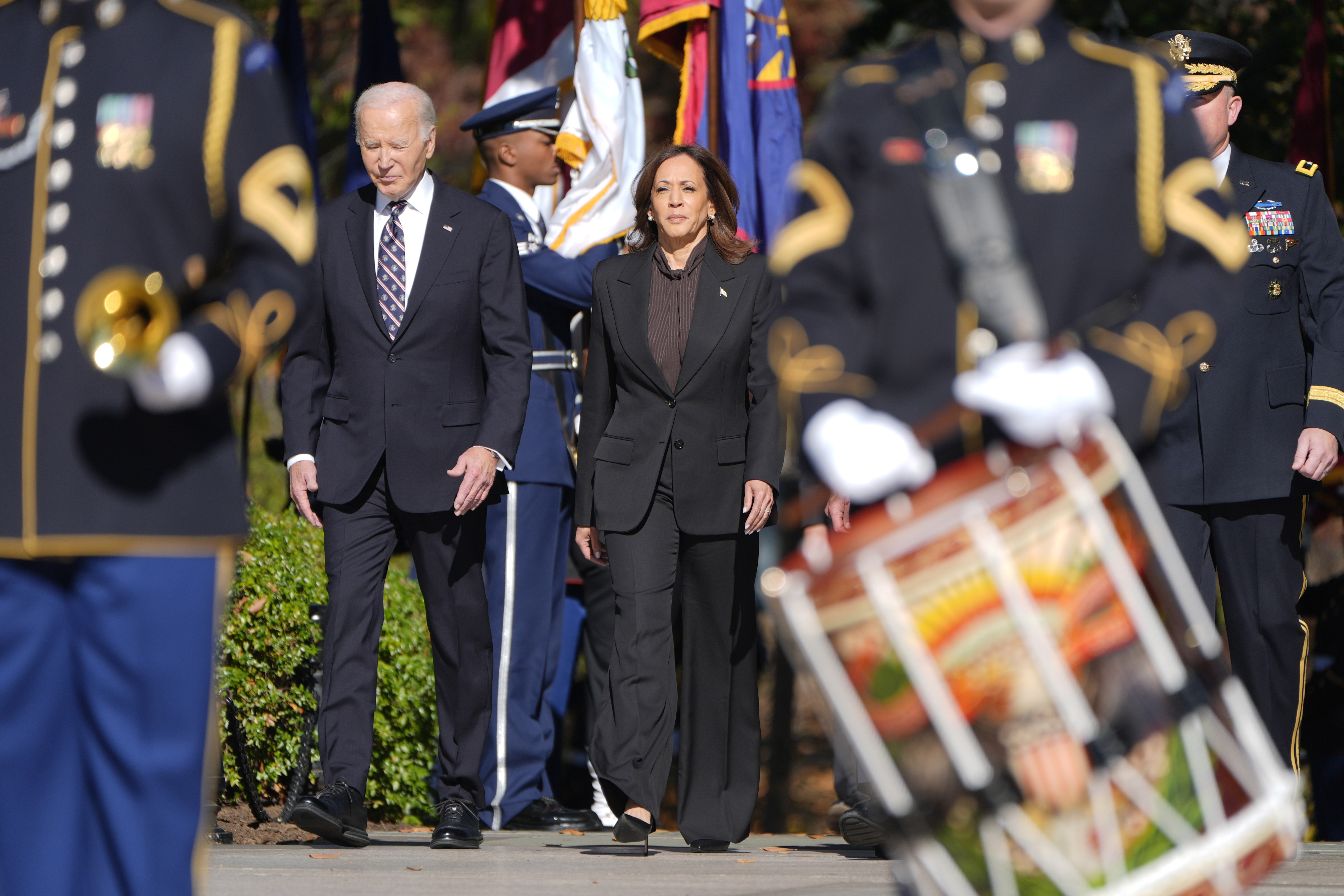 President Joe Biden, left, and Vice President Kamala Harris arrive at a wreath laying ceremony at the Tomb of the Unknown Soldier on National Veterans Day Observance at Arlington National Cemetery in Arlington, Va., Monday, Nov. 11, 2024. (AP Photo/Mark Schiefelbein)