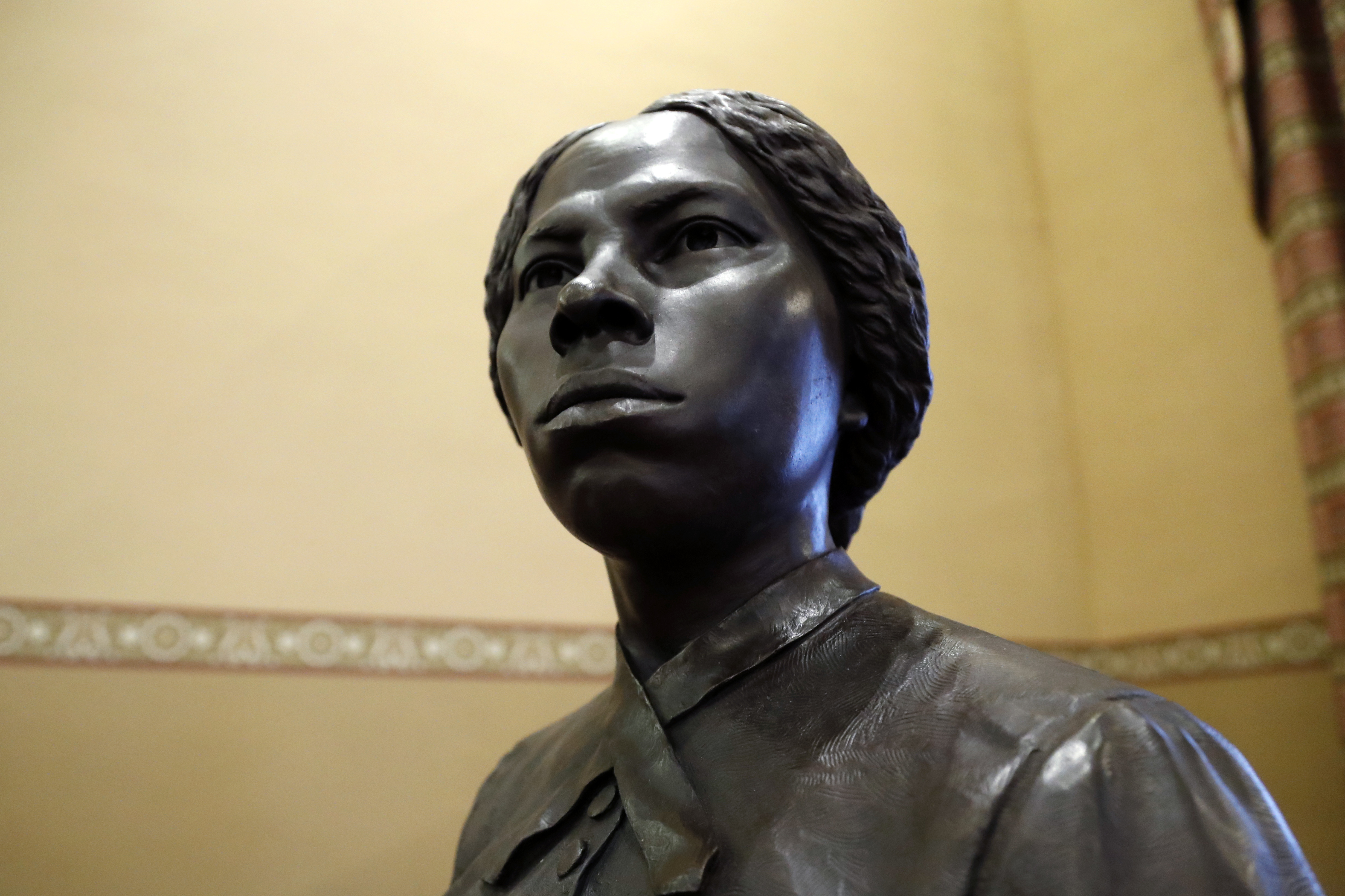 FILE - A bronze statue of abolitionist Harriet Tubman is seen at the Maryland State House, Feb. 10, 2020, in Annapolis, Md. (AP Photo/Julio Cortez, file)