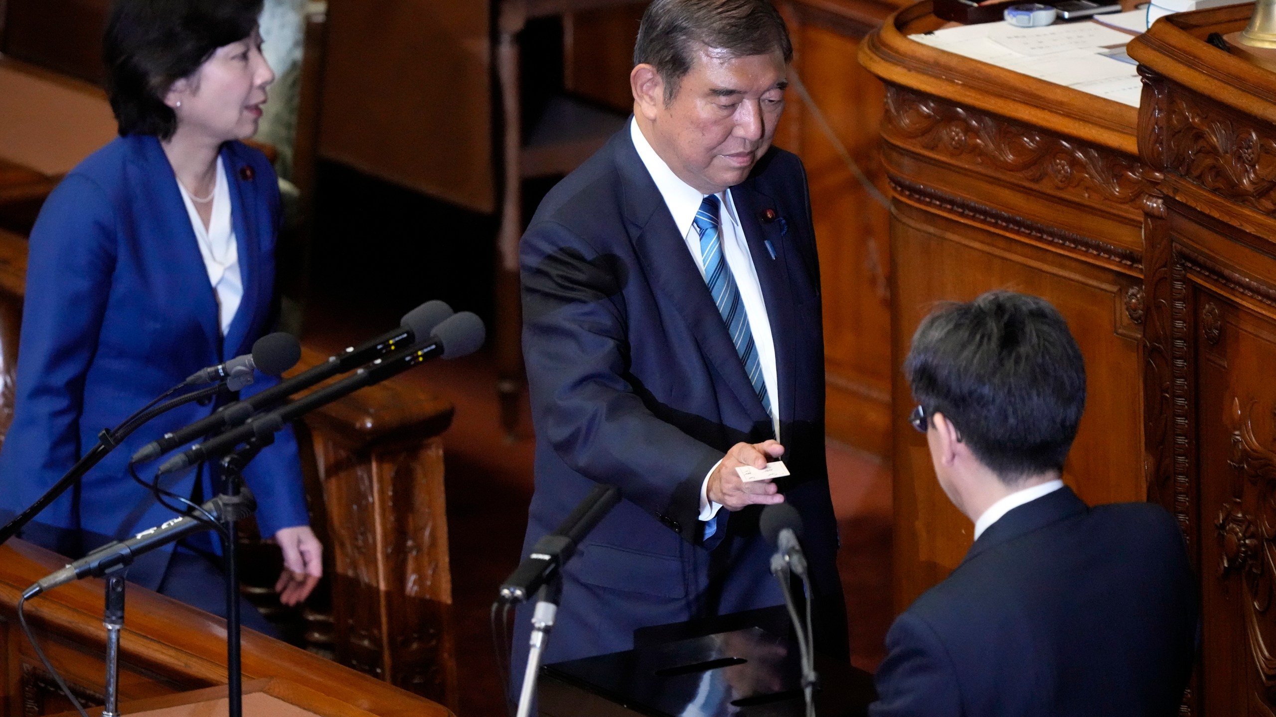 Japan's Prime Minister Shigeru Ishiba votes for the new prime minister at the parliament's lower house Monday, Nov. 11, 2024, in Tokyo. (AP Photo/Eugene Hoshiko)