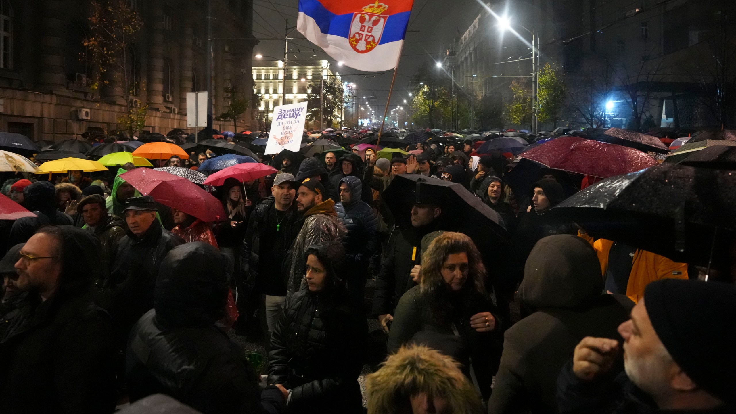 People march during a protest following the collapse of a concrete canopy at the railway station in Novi Sad that killed 14 people, in Belgrade, Serbia, Monday, Nov. 11, 2024. (AP Photo/Darko Vojinovic)