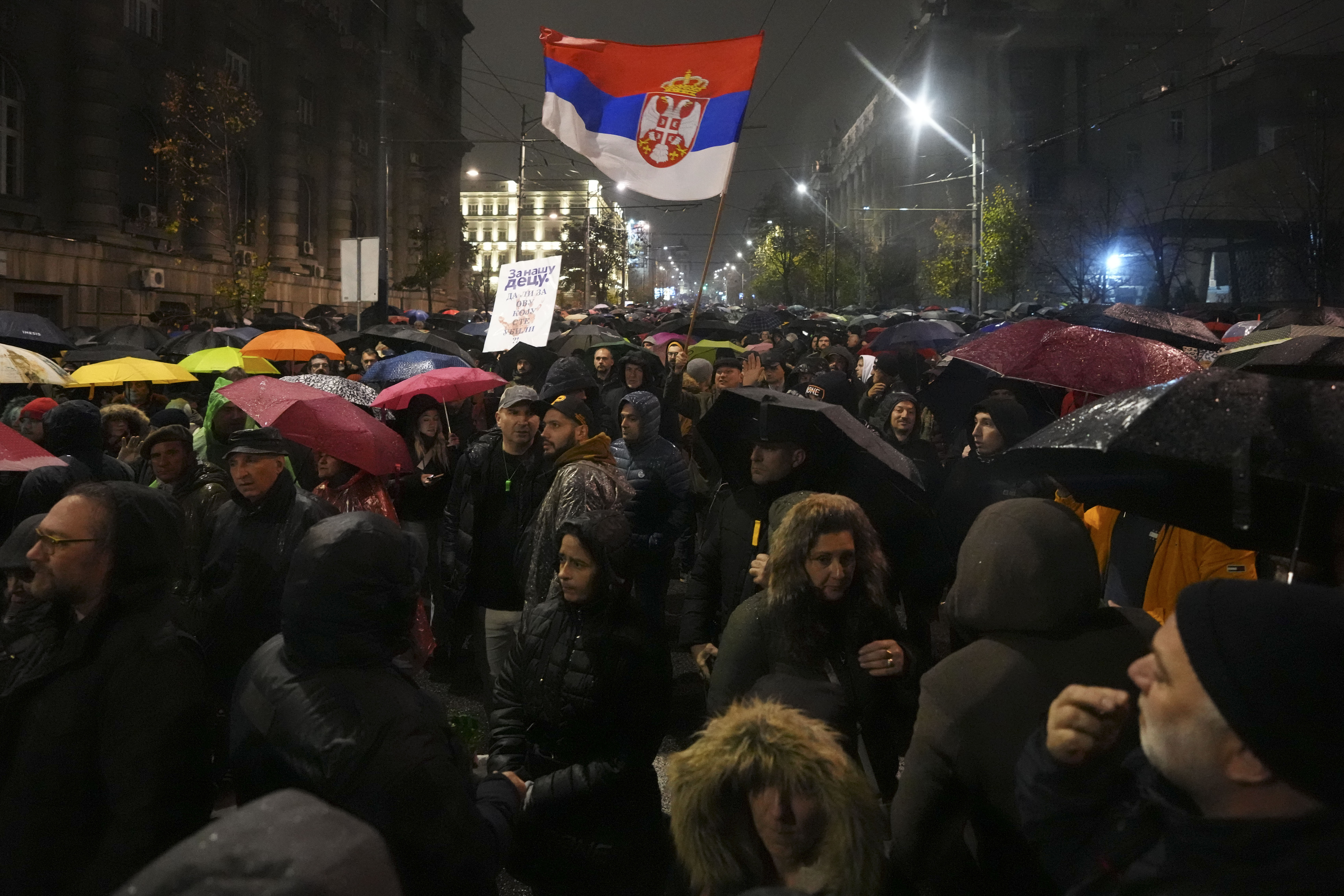 People march during a protest following the collapse of a concrete canopy at the railway station in Novi Sad that killed 14 people, in Belgrade, Serbia, Monday, Nov. 11, 2024. (AP Photo/Darko Vojinovic)