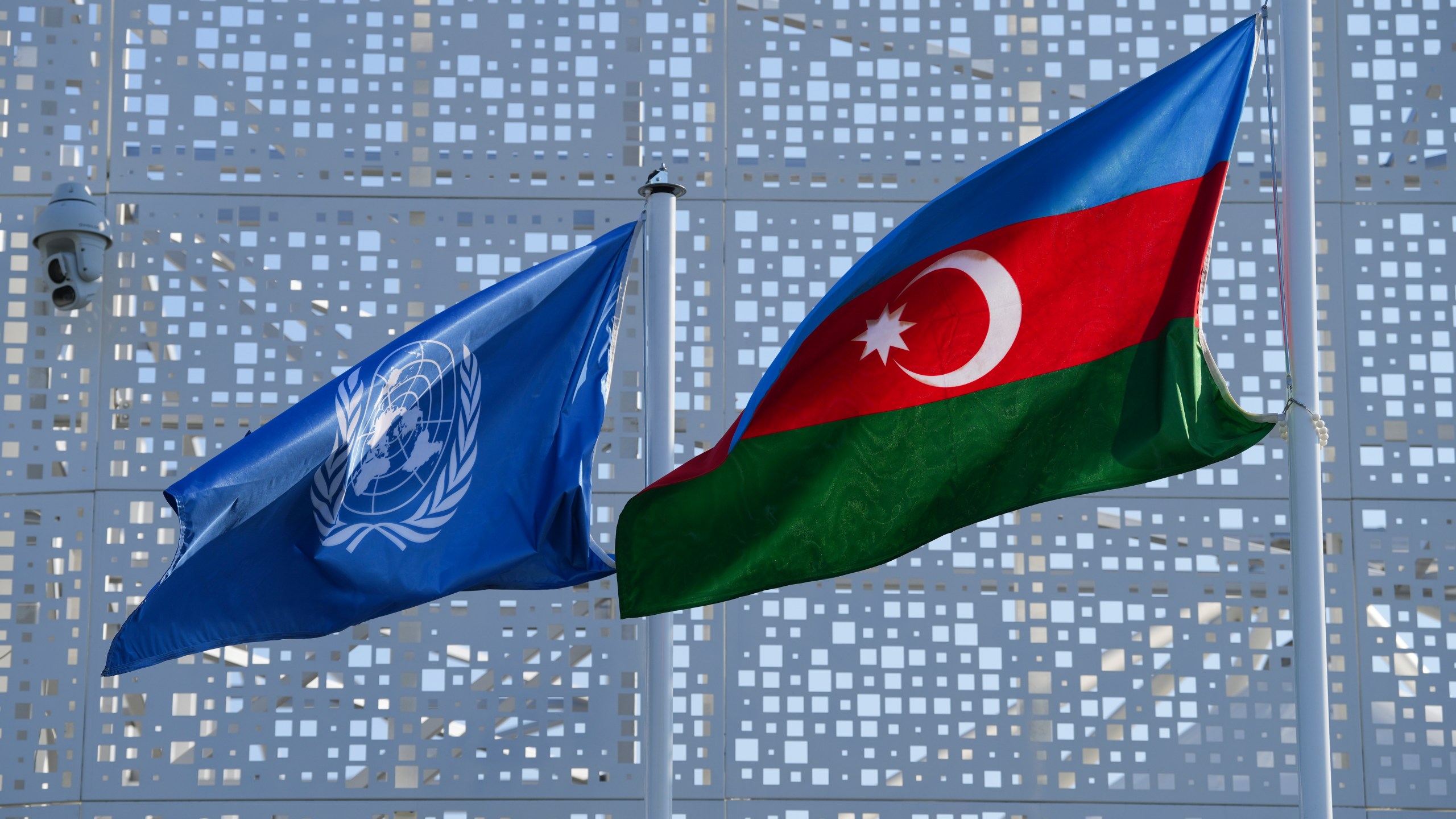 A flag for the United Nations and Azerbaijan are displayed outside the venue for the COP29 U.N. Climate Summit, Sunday, Nov. 10, 2024, in Baku, Azerbaijan. (AP Photo/Peter Dejong)