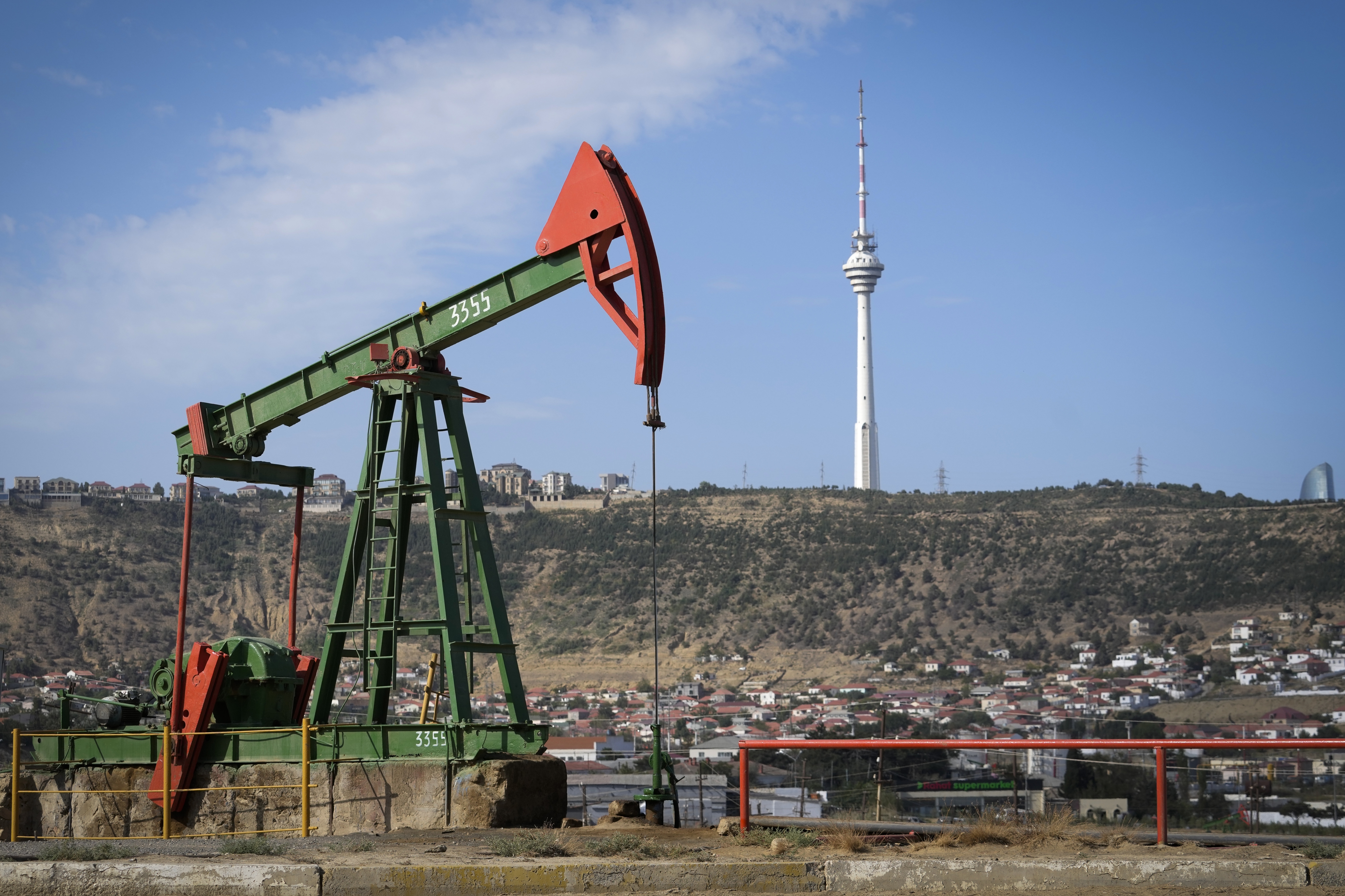 A pumpjack operates at a drilling site in Baku, Azerbaijan, Monday, Sept. 16, 2024. (AP Photo/Sergei Grits)