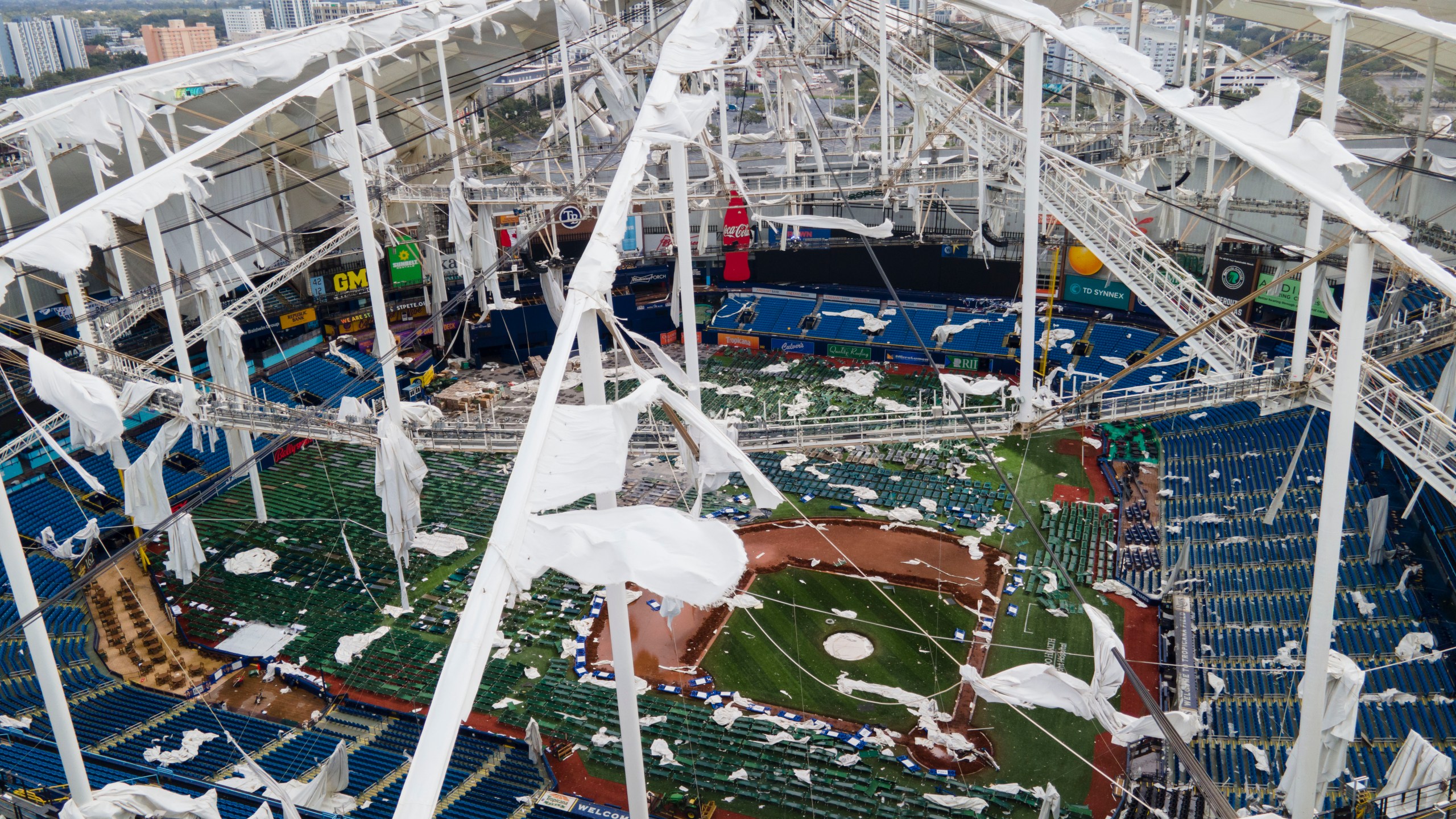 FILE - The roof of the Tropicana Field is damaged the morning after Hurricane Milton hit the region, Oct. 10, 2024, in St. Petersburg, Fla. (AP Photo/Julio Cortez, File)