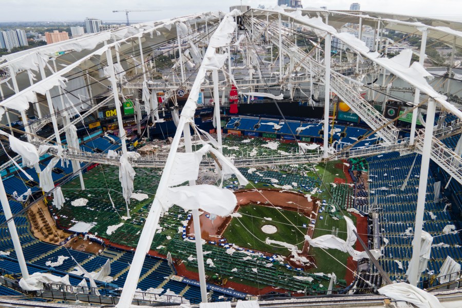 FILE - The roof of the Tropicana Field is damaged the morning after Hurricane Milton hit the region, Oct. 10, 2024, in St. Petersburg, Fla. (AP Photo/Julio Cortez, File)