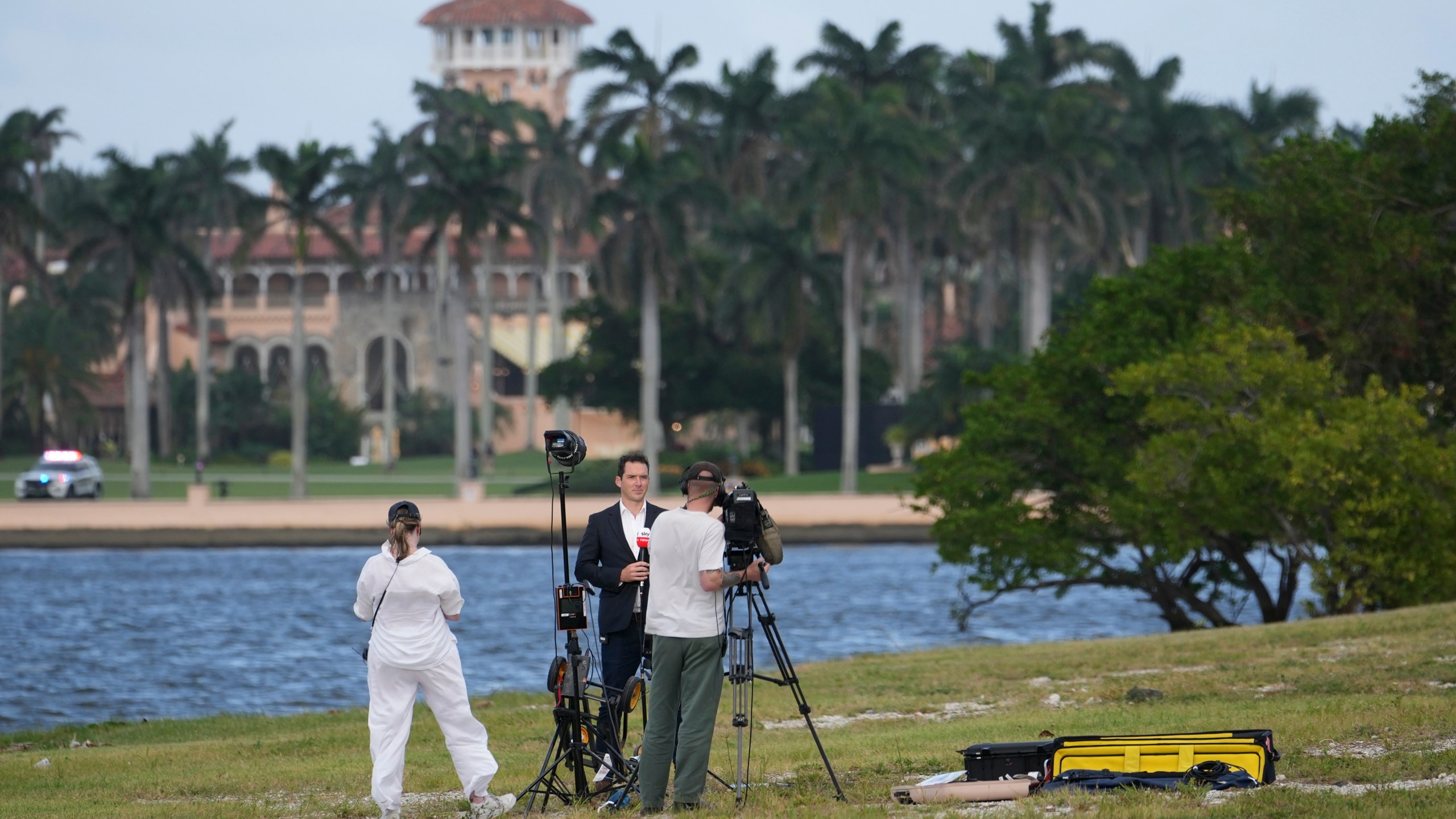 FILE - A television crew does a stand up across from the Mar-a-Lago estate of President-elect Donald Trump, Nov. 4, 2024, in Palm Beach, Fla. (AP Photo/Lynne Sladky, File)