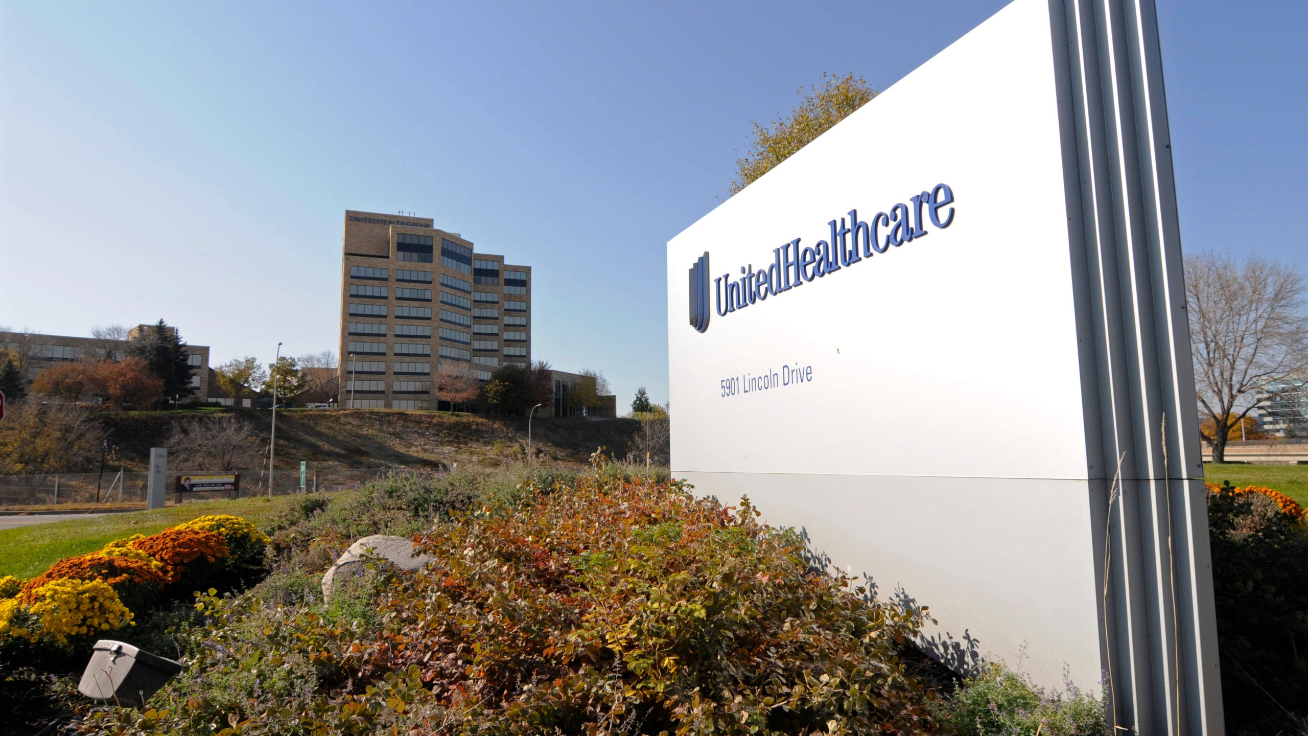 FILE - A sign stands on UnitedHealth Group Inc.'s campus in Minnetonka, Minn., Oct. 16, 2012. (AP Photo/Jim Mone, File)