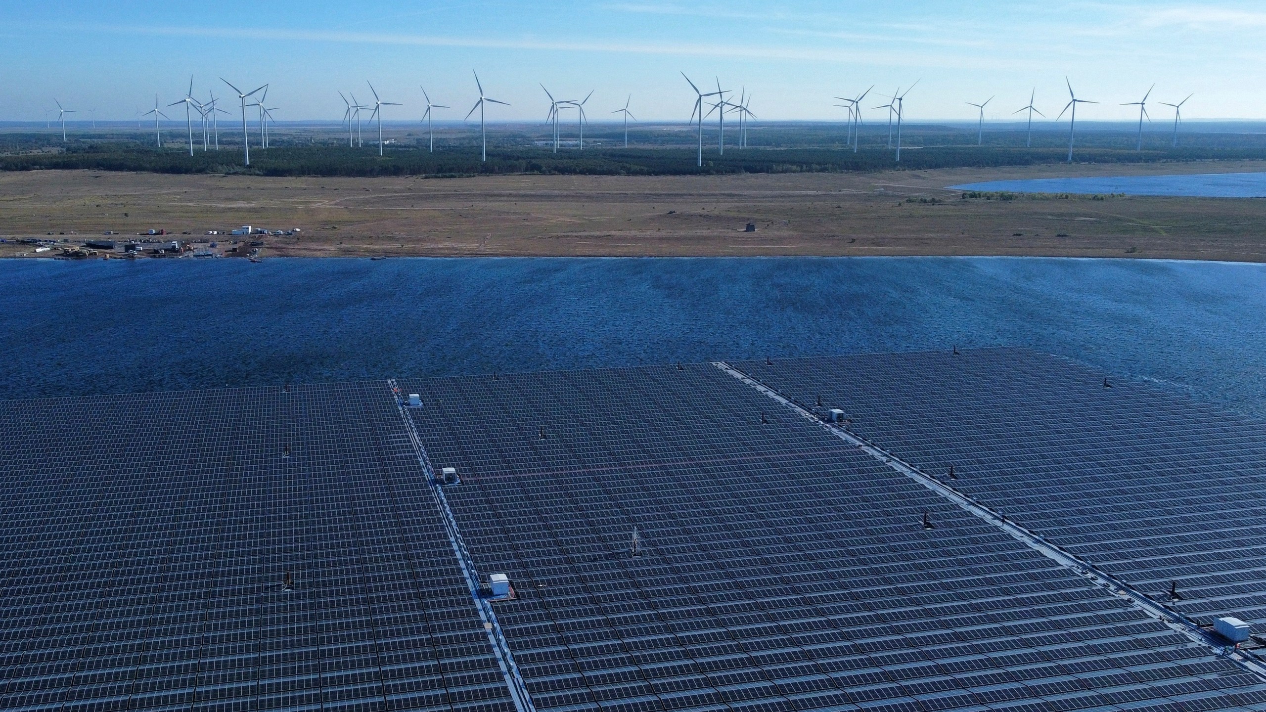 Floating solar panels operate on the Cottbuser Ostsee lake near Cottbus, Germany, Wednesday, Oct. 16, 2024. (AP Photo/Matthias Schrader)