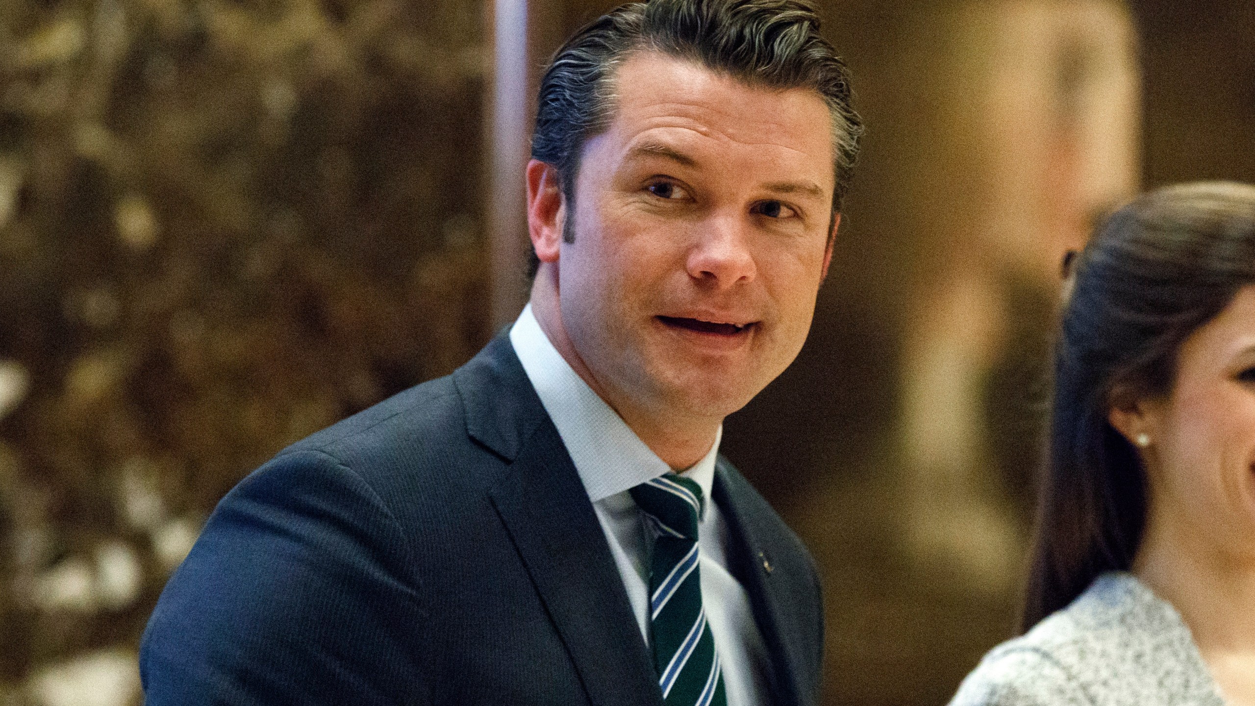 FILE - Pete Hegseth walks to an elevator for a meeting with President-elect Donald Trump at Trump Tower in New York, Dec. 15, 2016. (AP Photo/Evan Vucci, File)