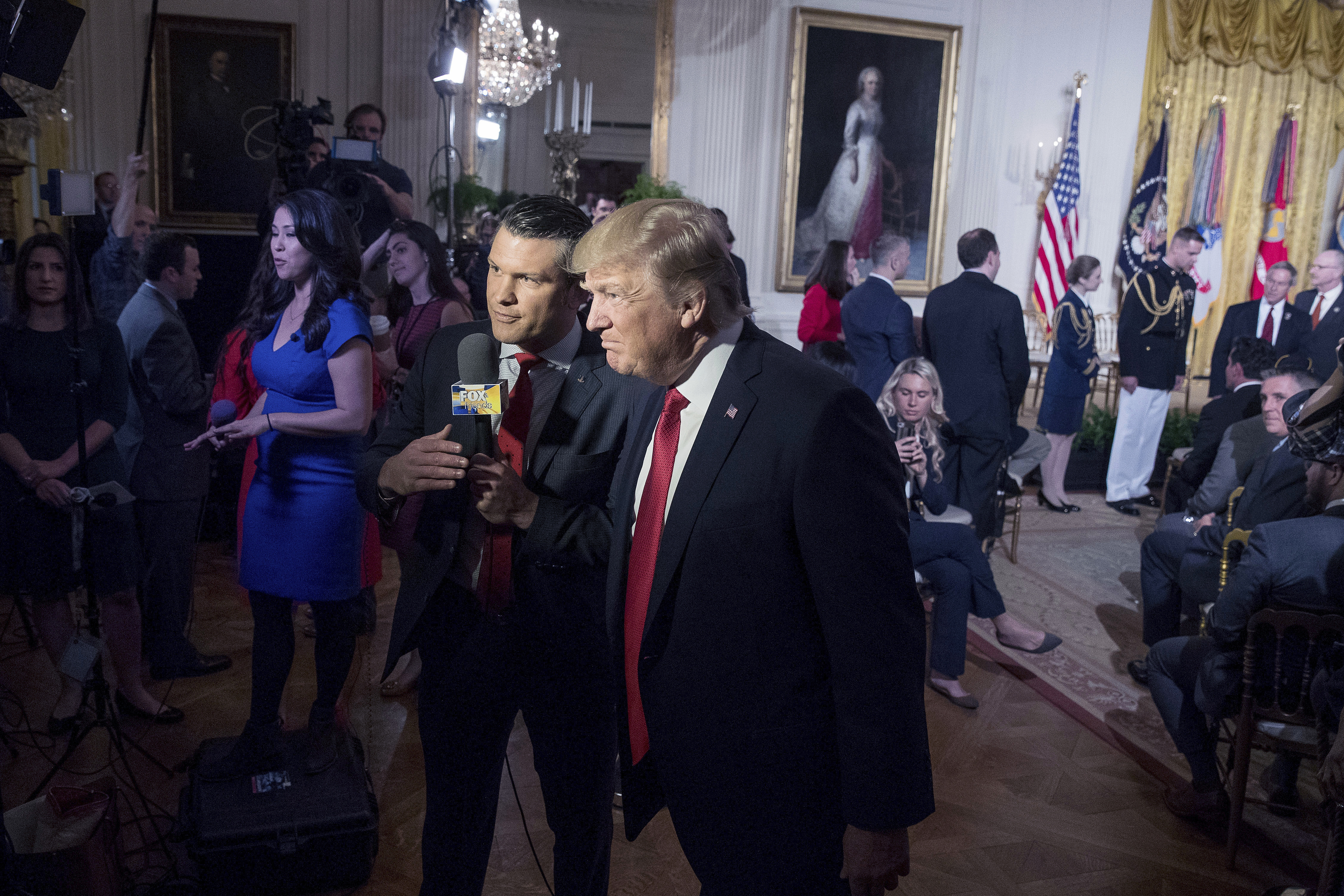 File - President Donald Trump appears on Fox & Friends co-host Pete Hegseth at a Wounded Warrior Project Soldier Ride event in the East Room of the White House in Washington, Thursday, April 6, 2017. (AP Photo/Andrew Harnik, File)