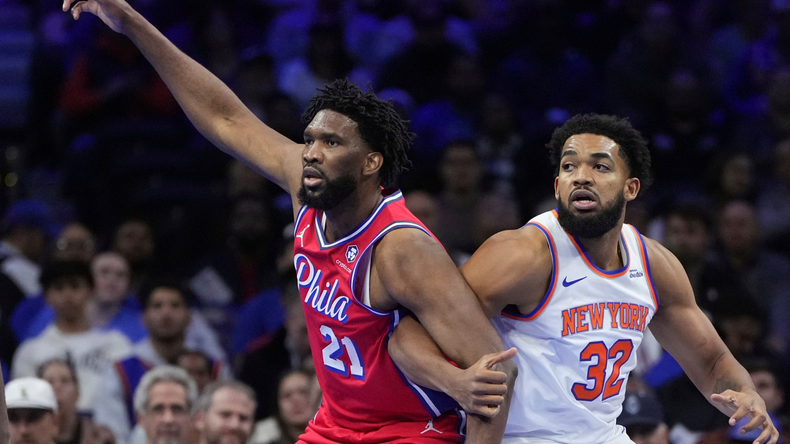 Philadelphia 76ers' Joel Embiid, left, and New York Knicks' Karl-Anthony Towns struggle for position during the first half of an Emirates NBA Cup basketball game, Tuesday, Nov. 12, 2024, in Philadelphia. (AP Photo/Matt Slocum)