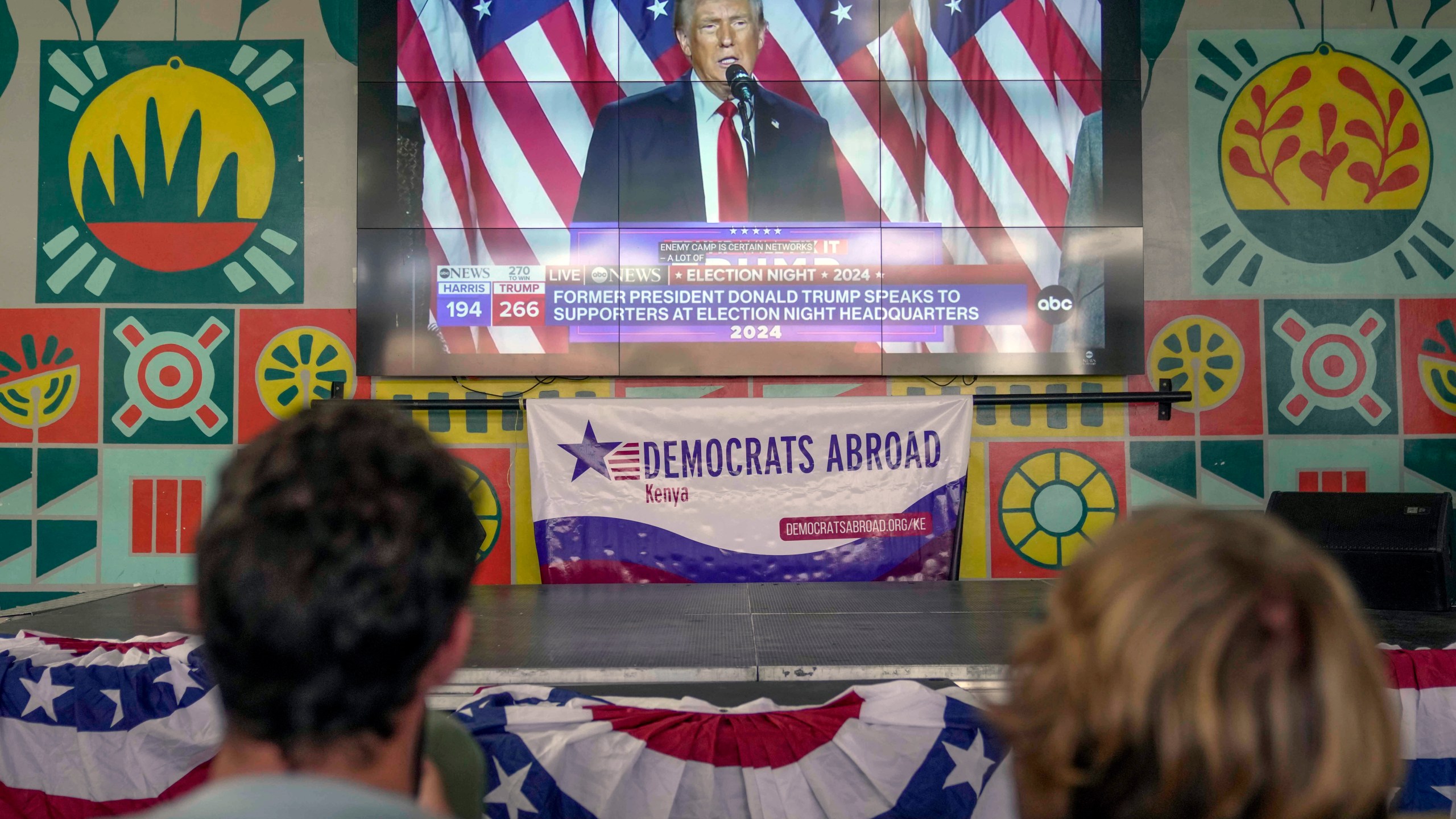 FILE- A screen shows live footage of Republican presidential nominee former President Donald Trump speech during a news program in Nairobi, Kenya, Wednesday, Nov. 6, 2024. (AP Photo/Brian Inganga, file)